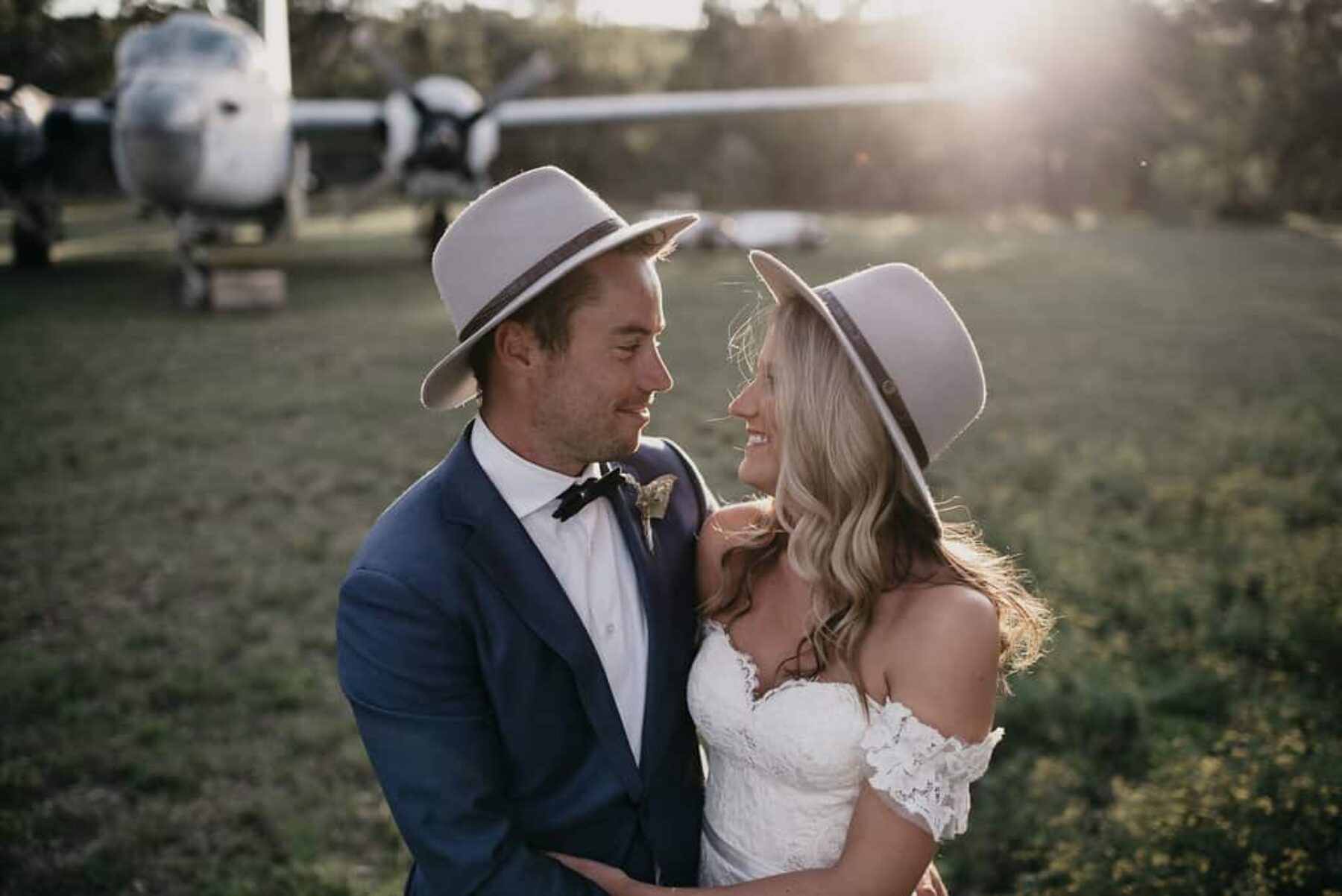 bride and groom in Dingo hats