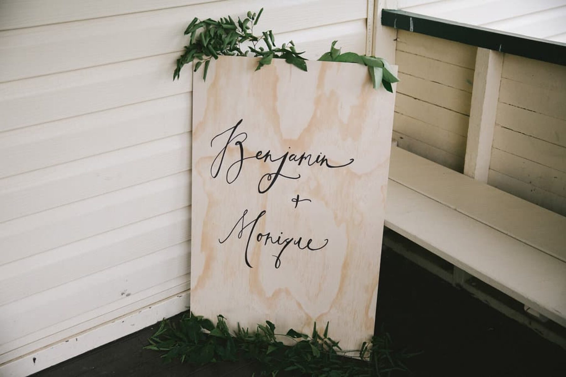 hand-lettered wooden wedding sign