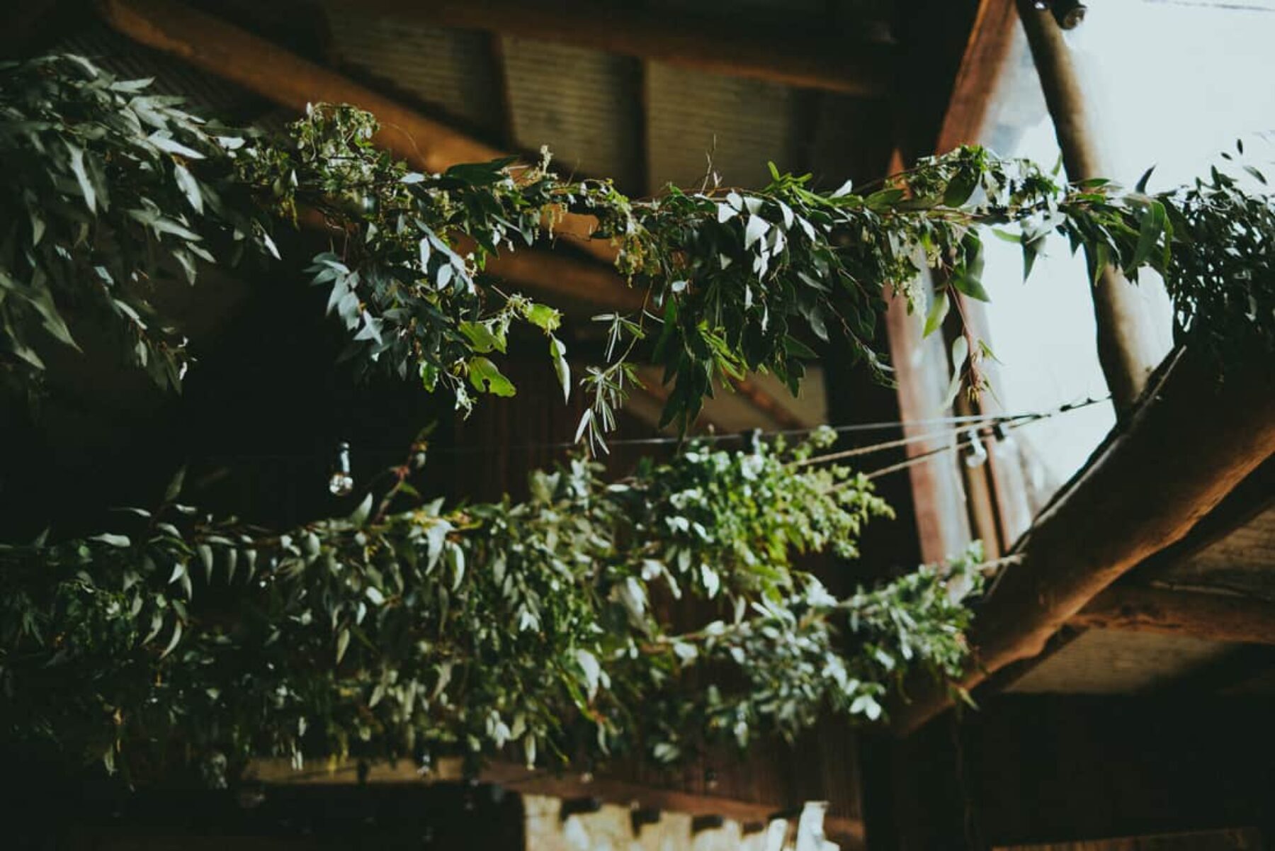 DIY barn wedding with foliage garlands