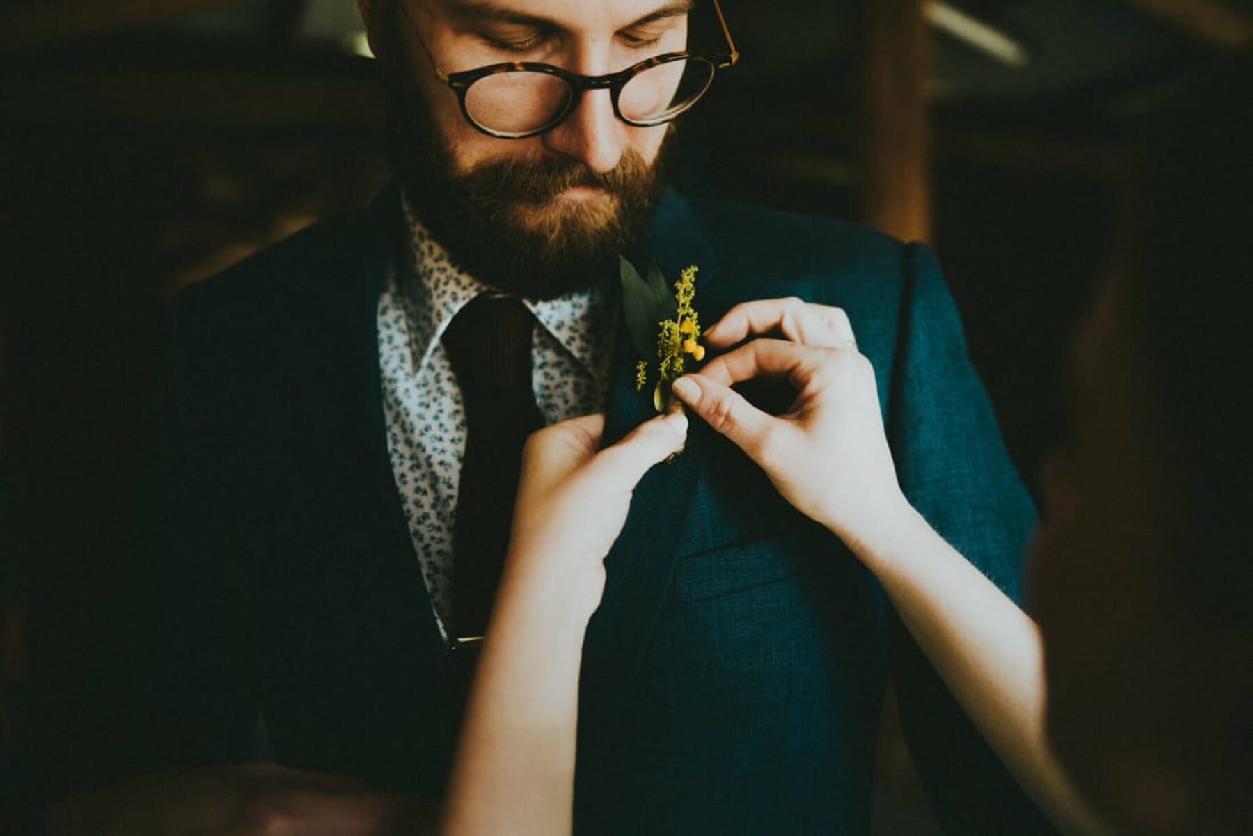bearded and bespectacled groom