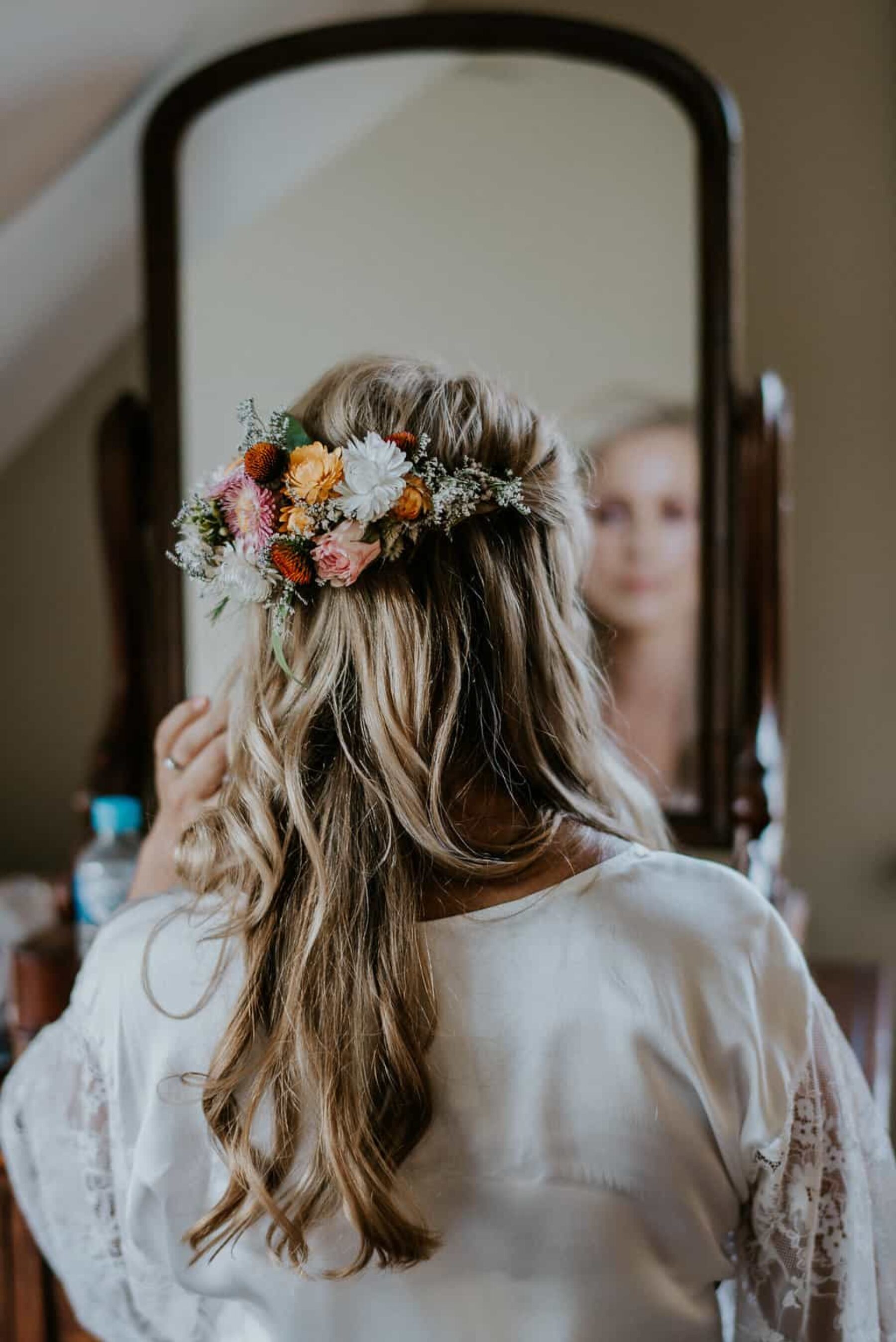 loose bridal hair with floral hairpiece
