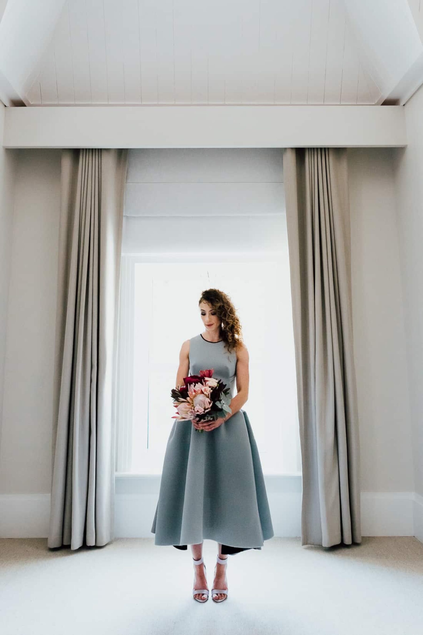 modern bride in structured Toni Maticevski grey dress