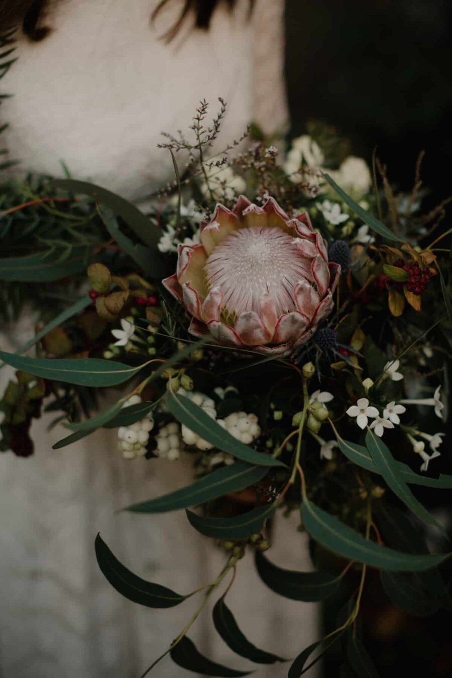 unstructured bridal bouquet with pink protea