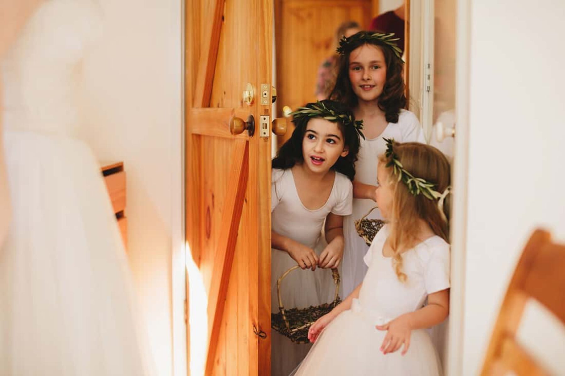 flower girls with olive crowns