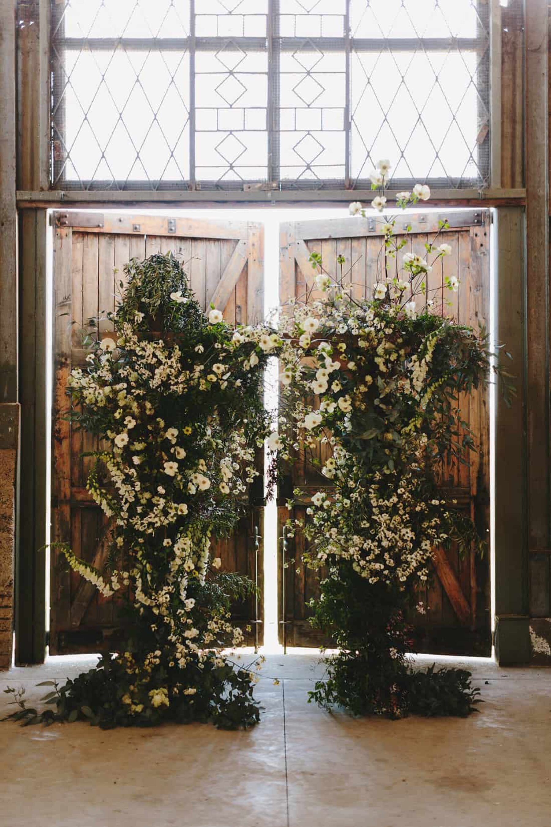 lush greenery wedding arbour by Cecilia Fox