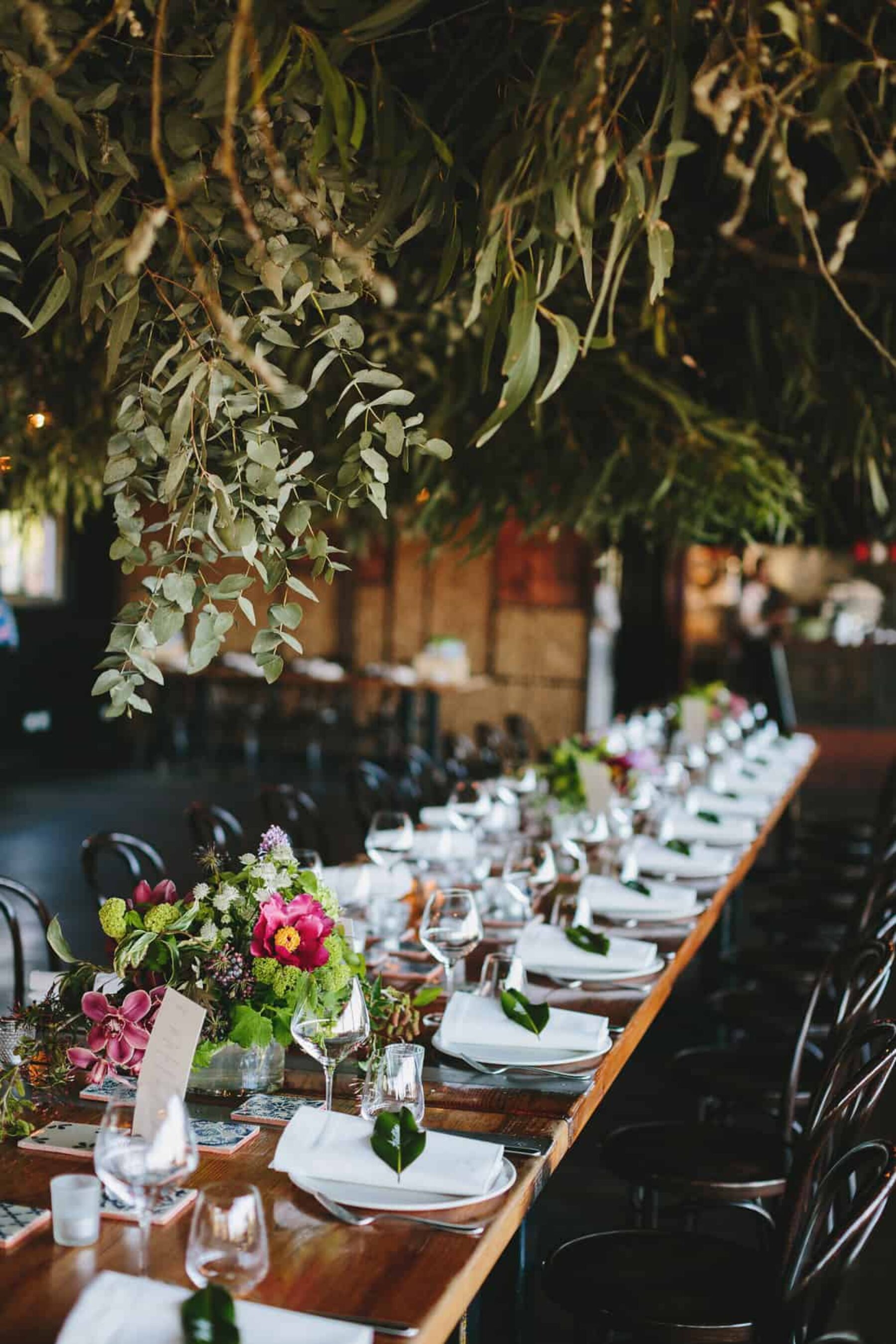 rustic wedding with hanging foliage installations