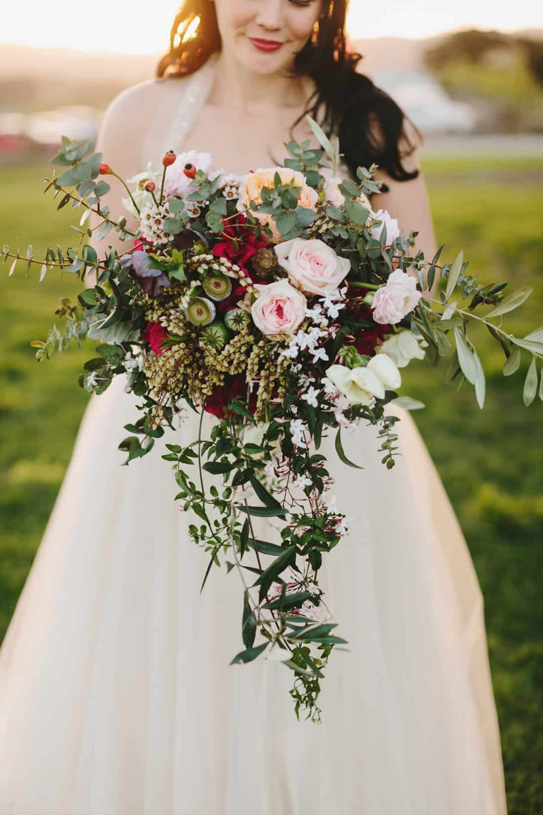 cascading birdal bouquet with roses and native foliage