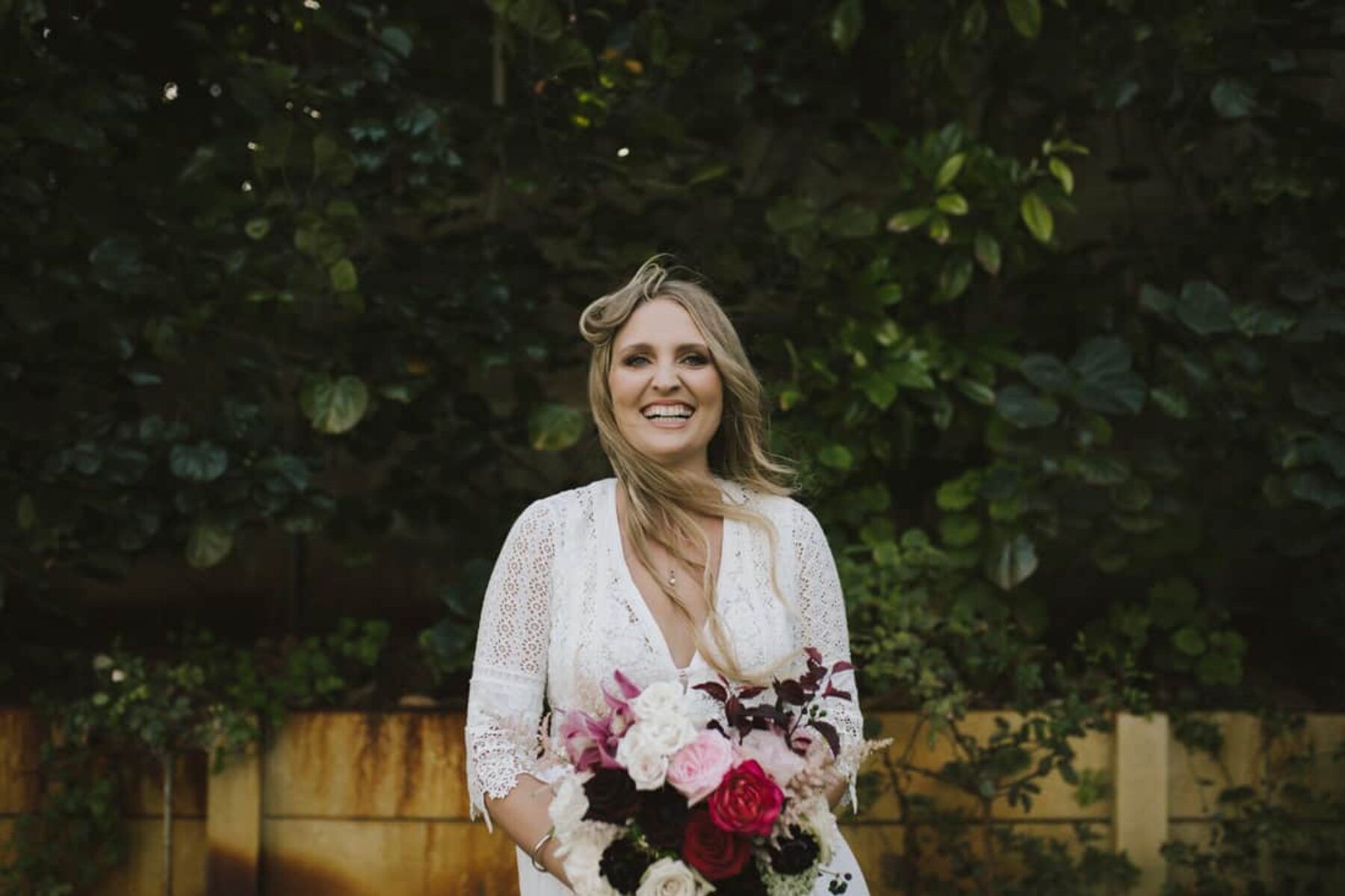 boho bride with blush and burgundy bridal bouquet