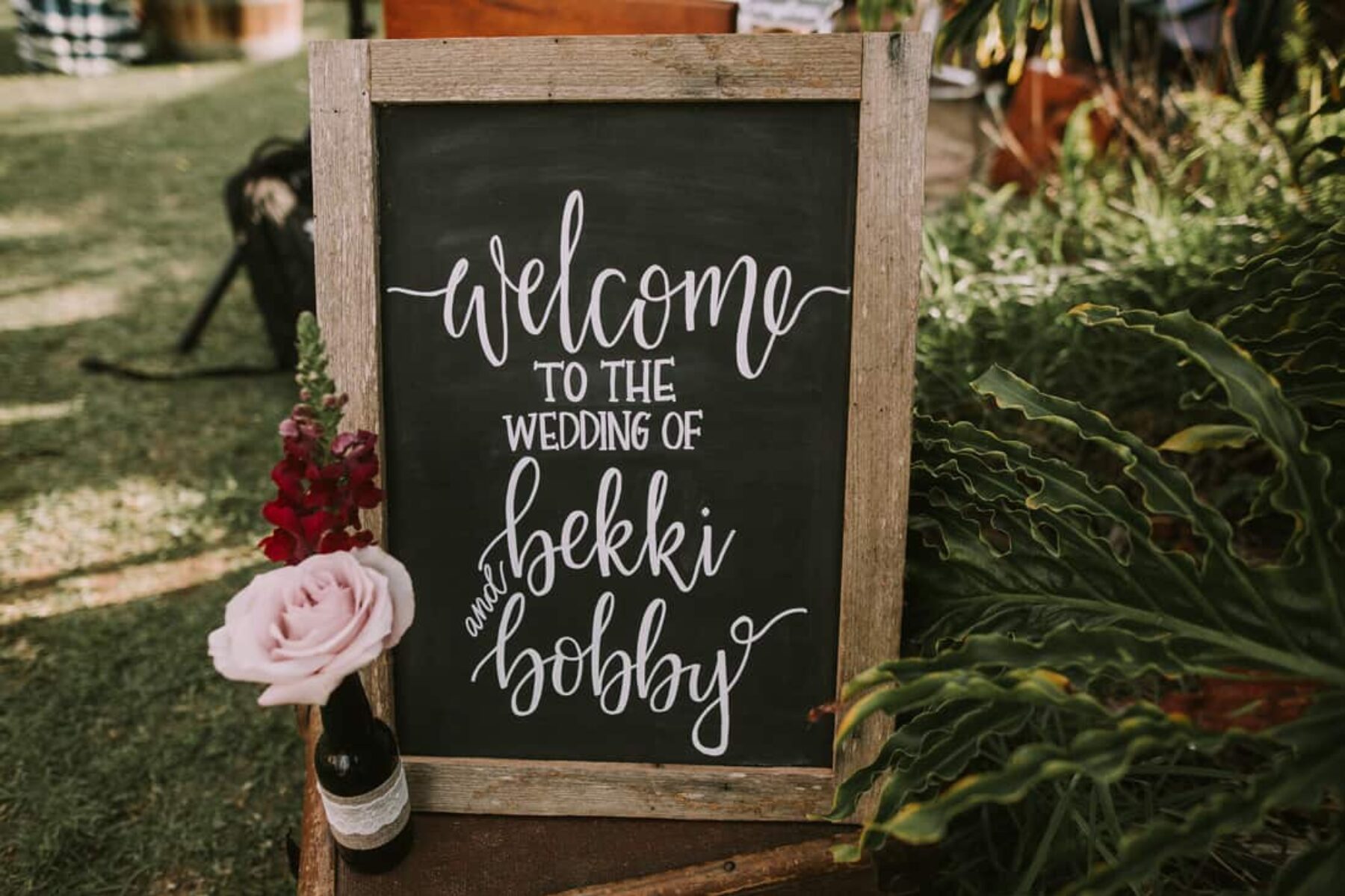 hand-lettered wedding welcome chalk board