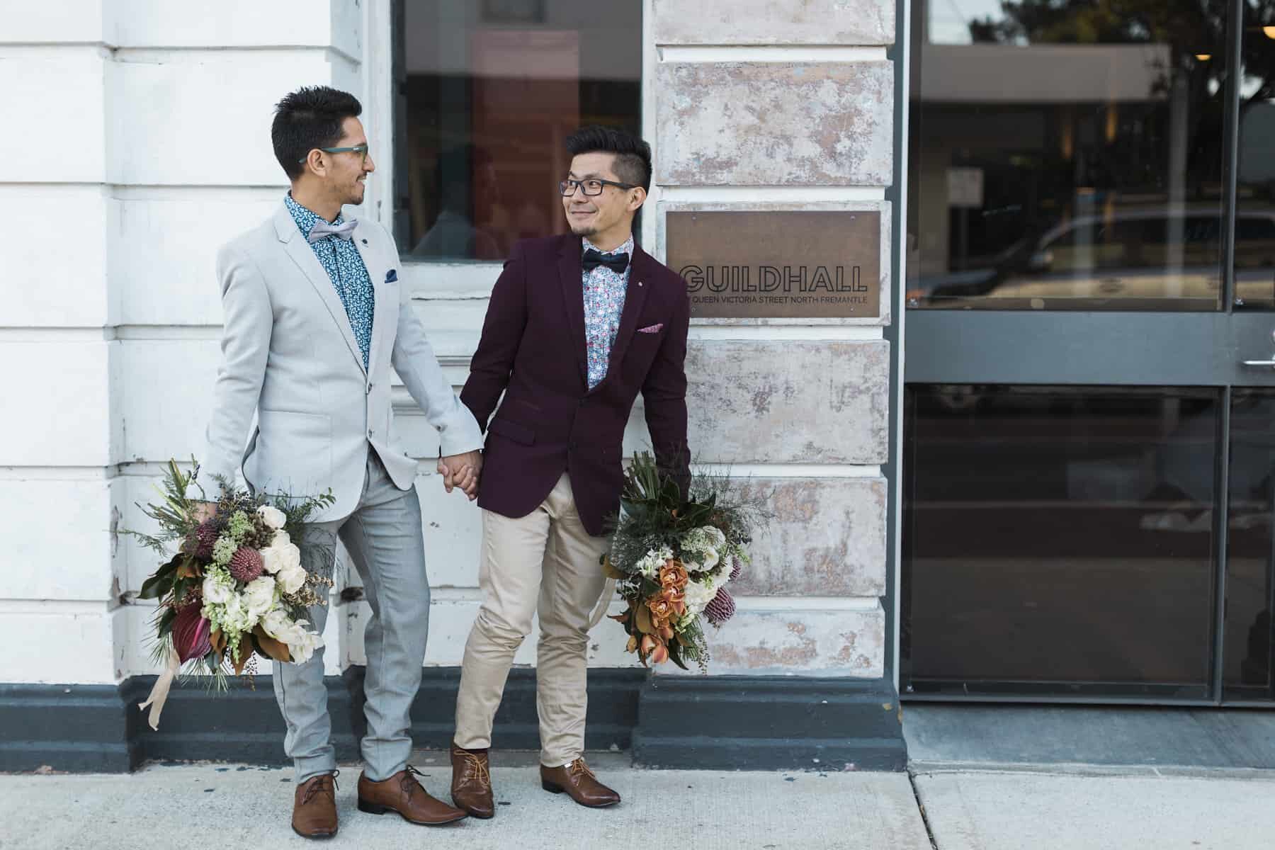 stylish grooms with blooms