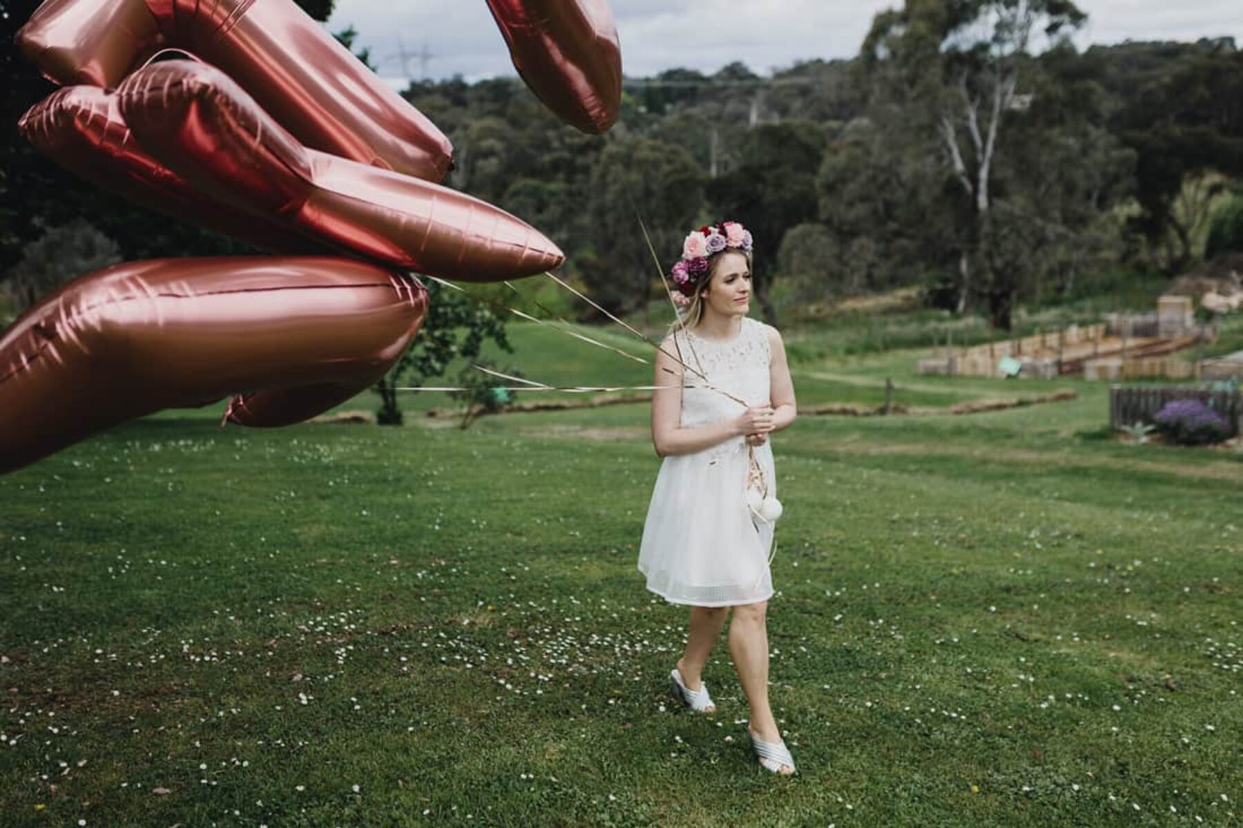 bride with giant rose gold balloons