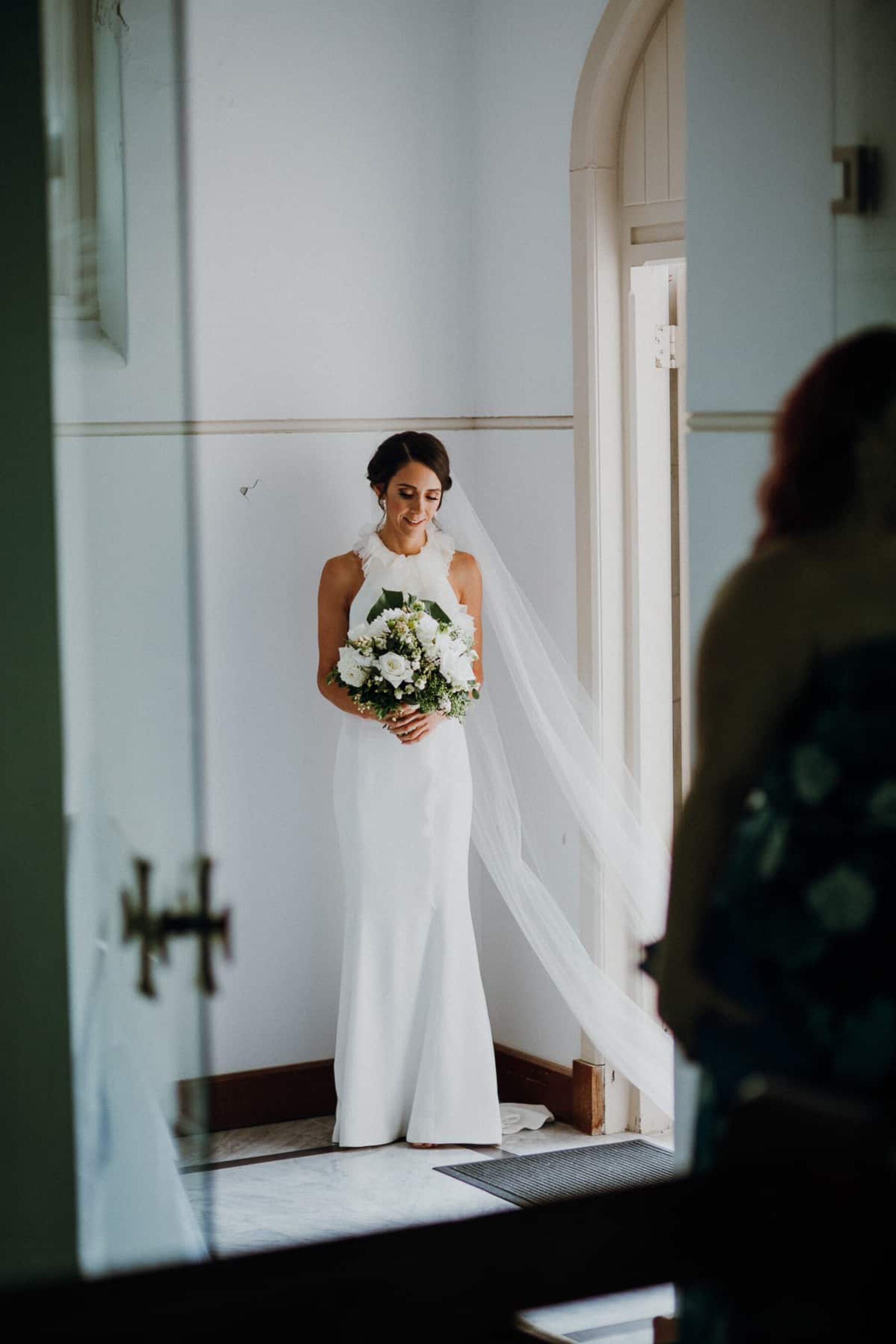 modern bride with green and white bouquet
