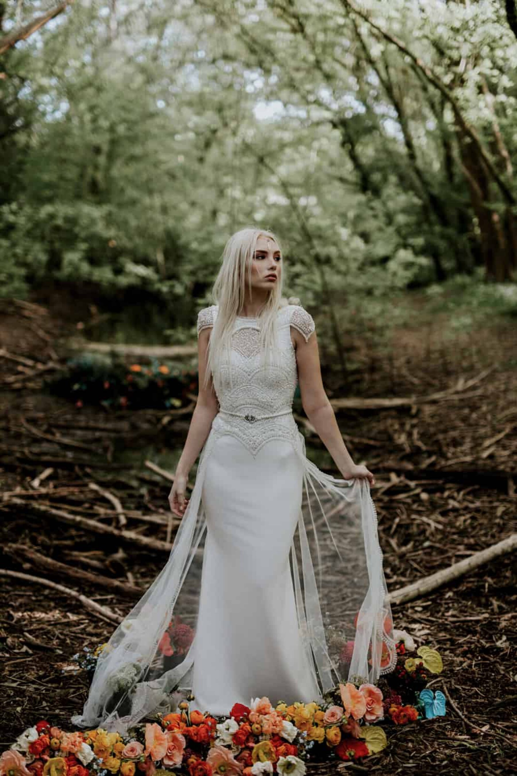 modern structured wedding dress with embellished cap sleeves