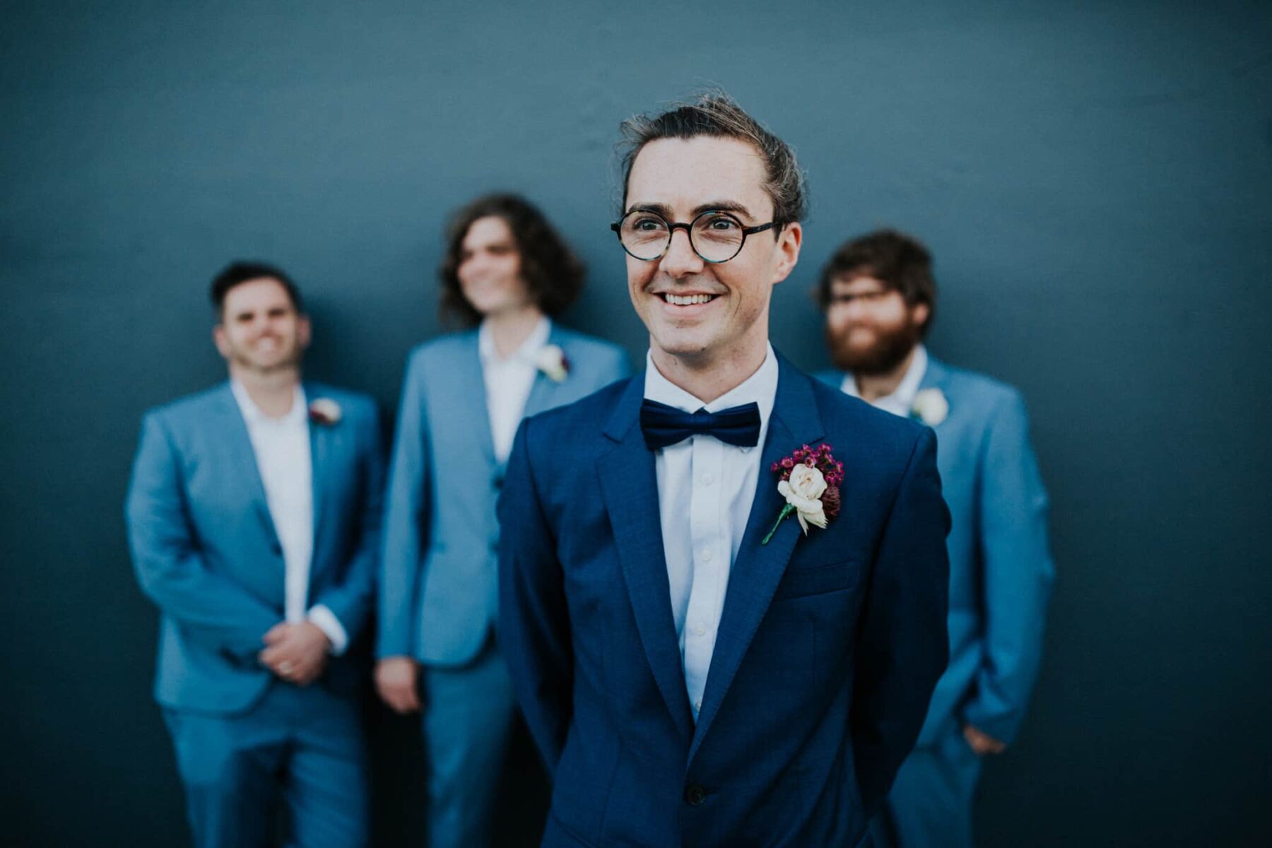 Groom and groomsmen in mixed blue suits