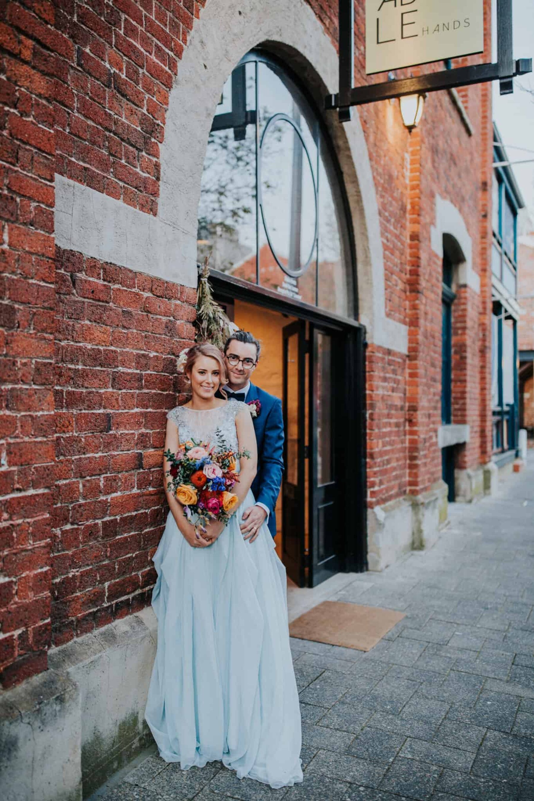 blush-haired bride with pale blue wedding dress