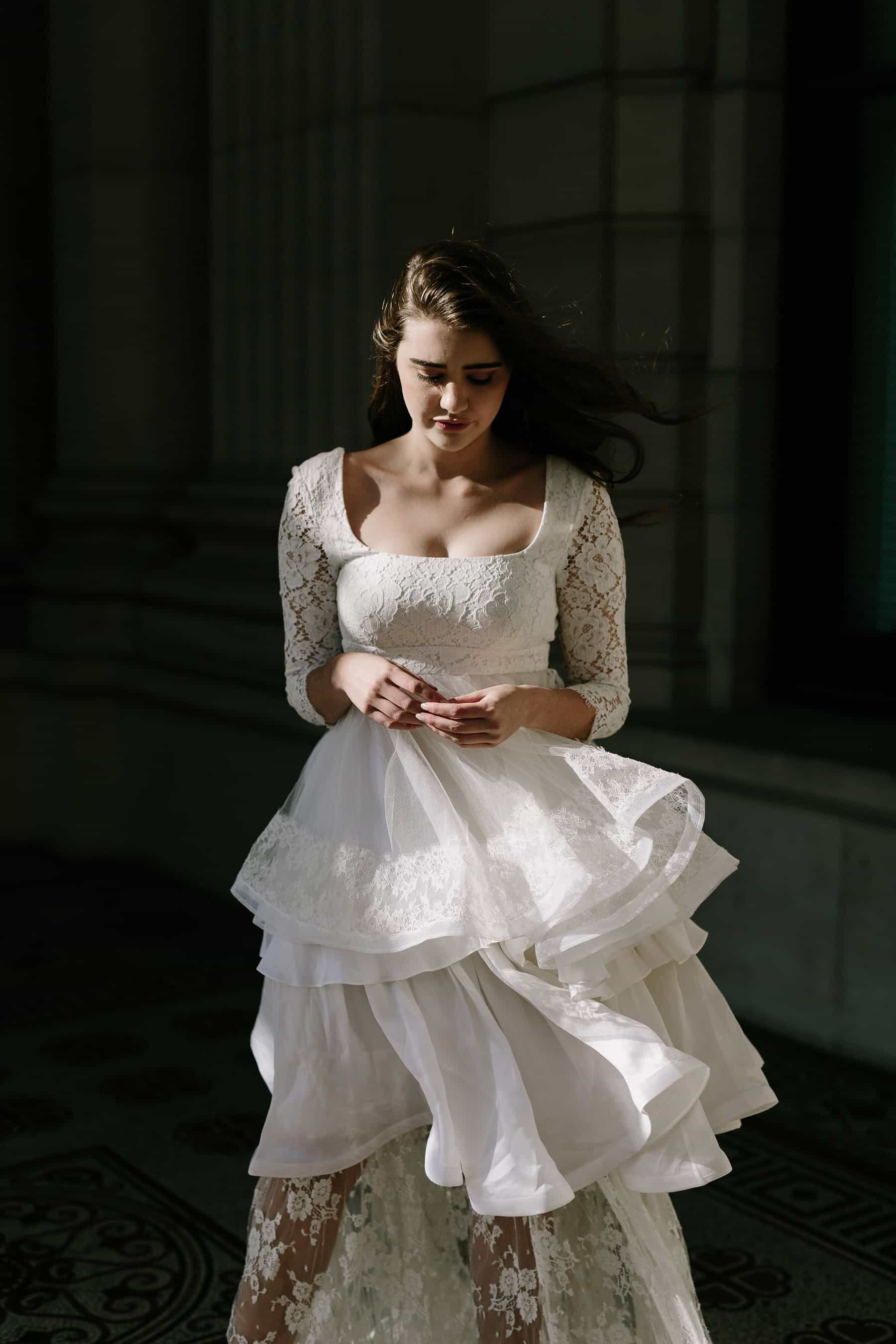 long sleeve lace weddng dress with tiered ruffle skirt