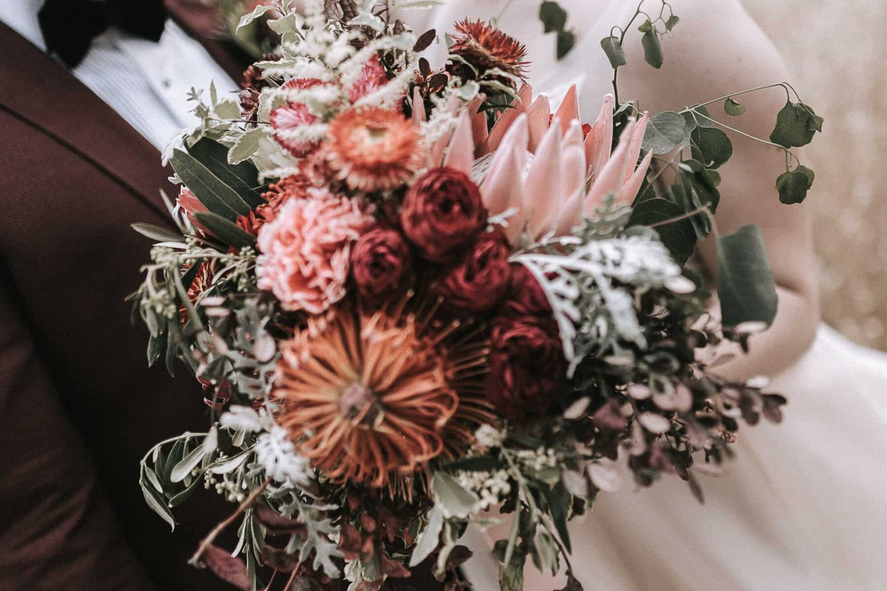 blush and burgundy king protea bouquet