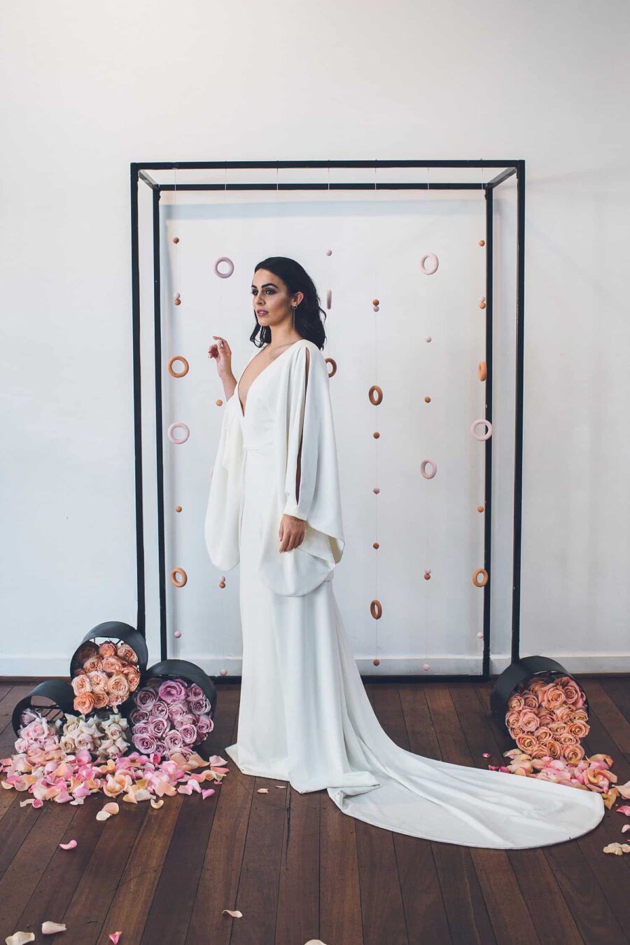 minimal wedding dress with sculptural sleeves by One Day Bridal