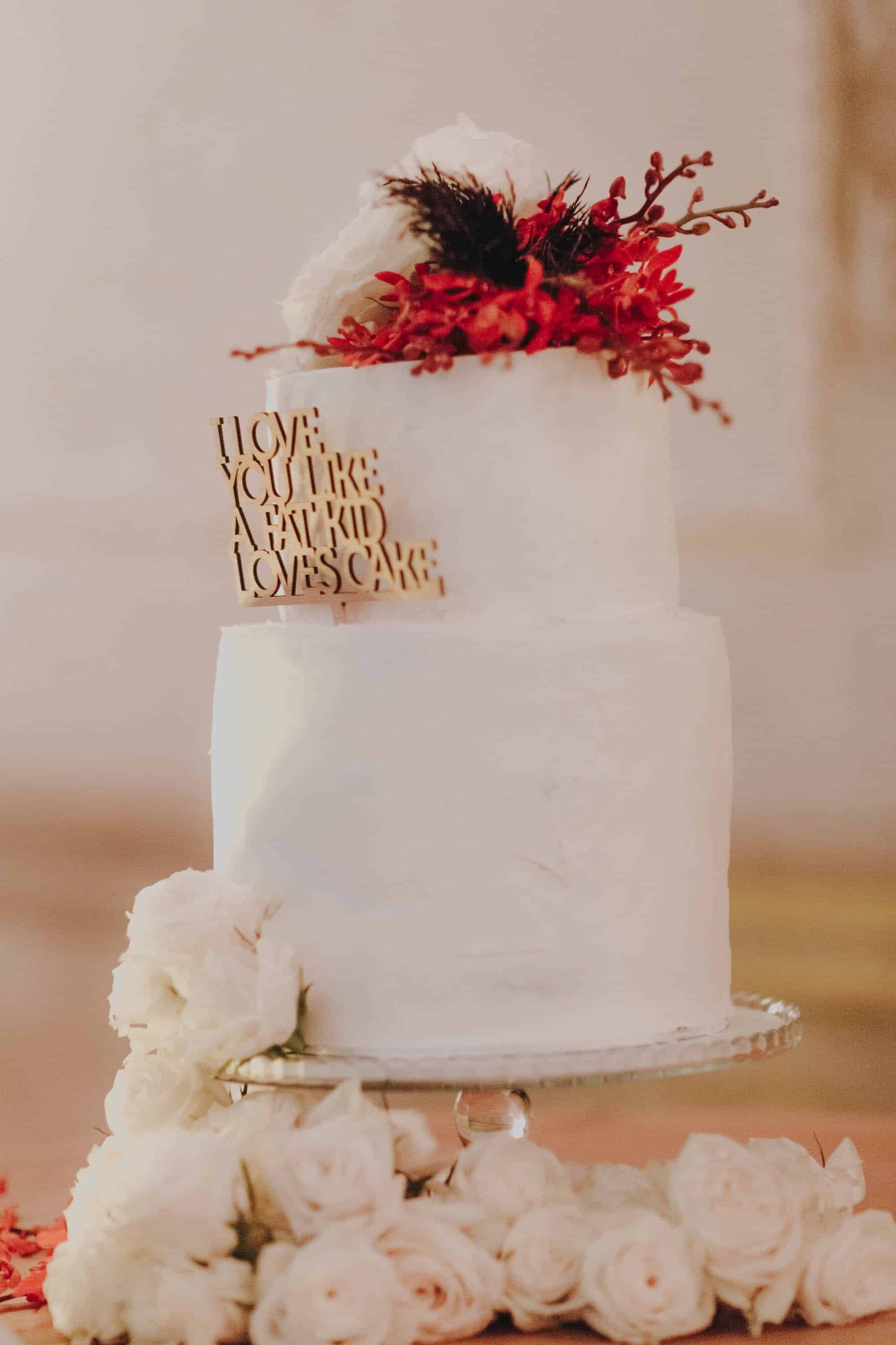 simple wedding cake with wooden topper