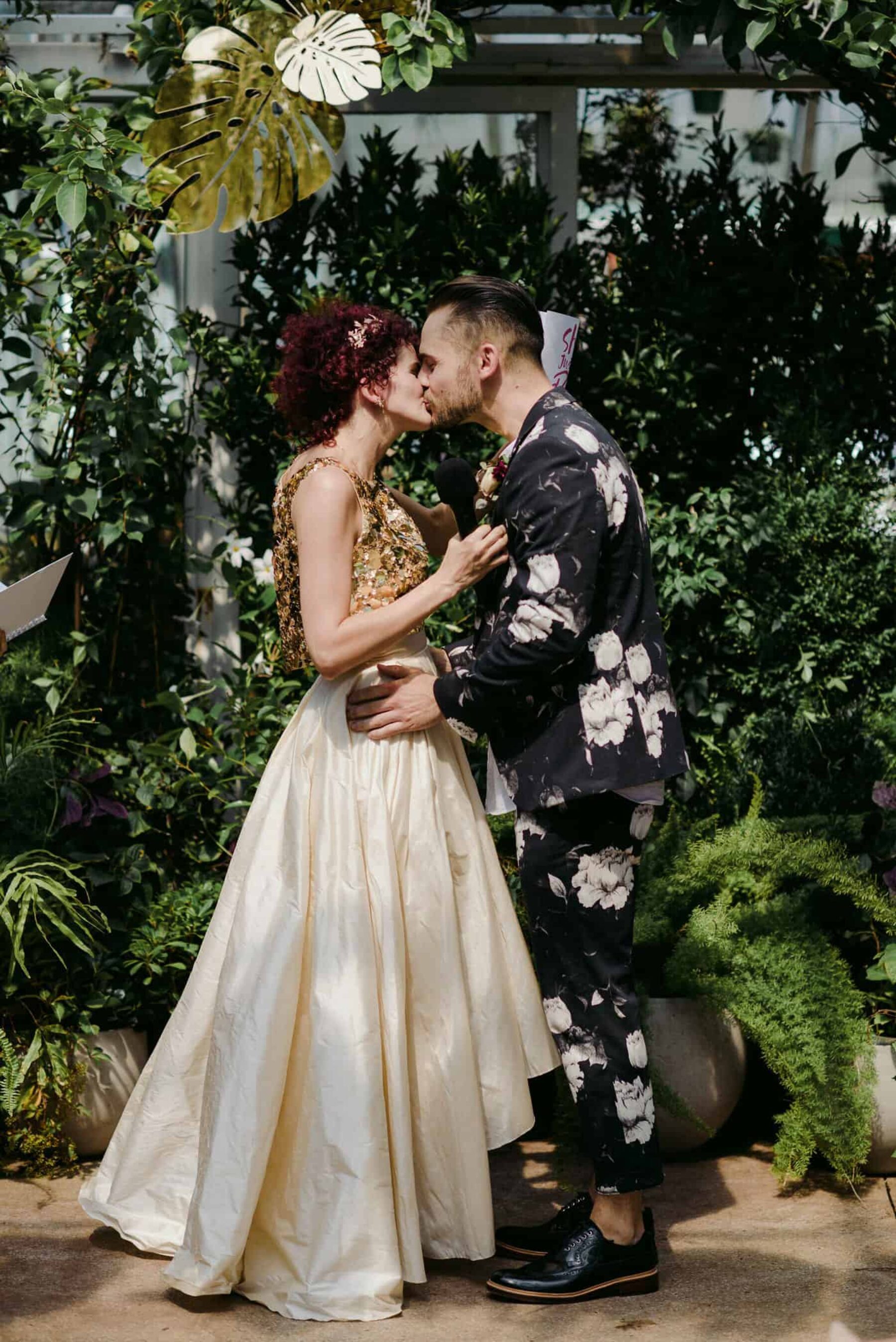 unique bride in gold two-piece wedding dress + groom in floral suit