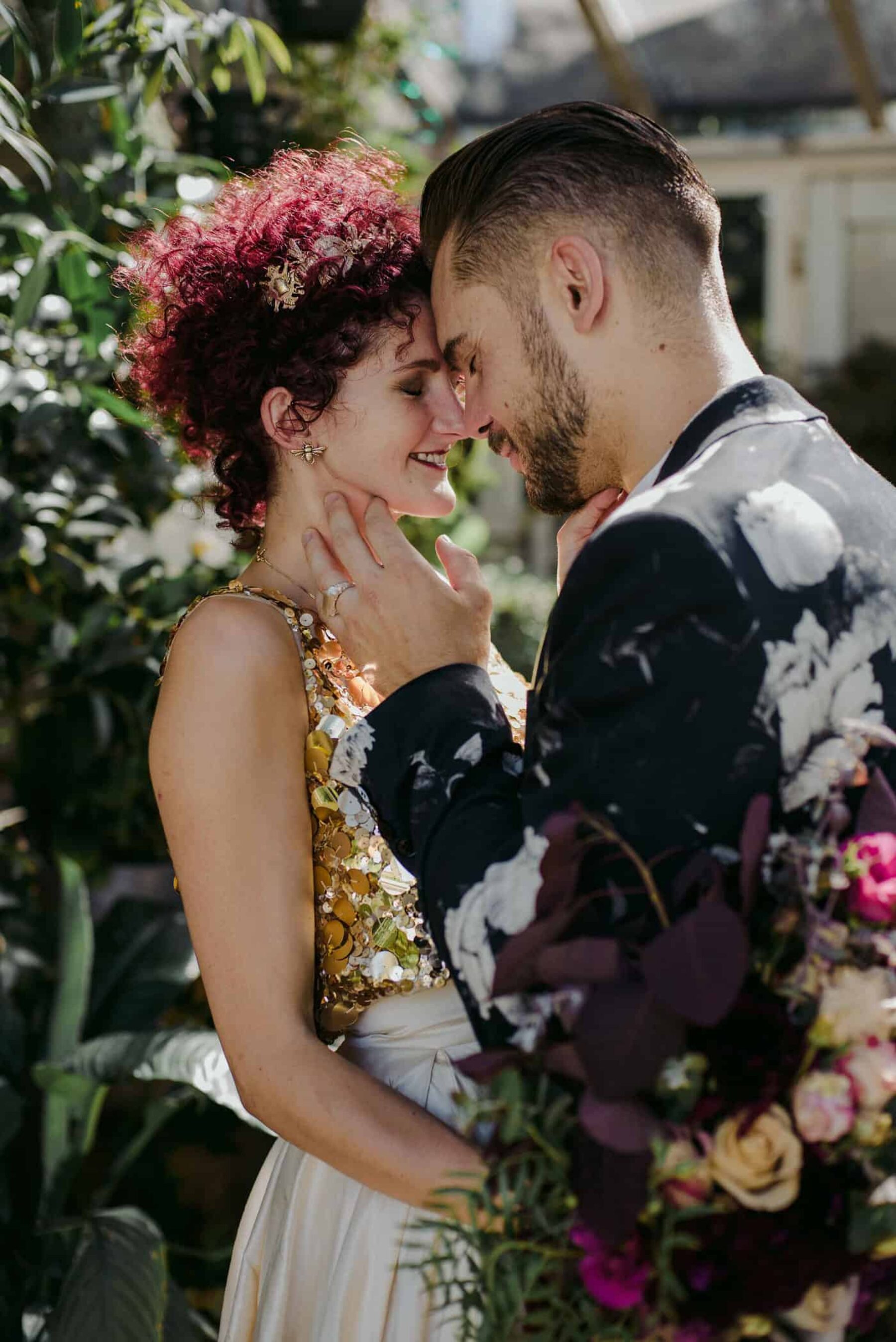 unique bride in gold two-piece wedding dress + groom in floral suit