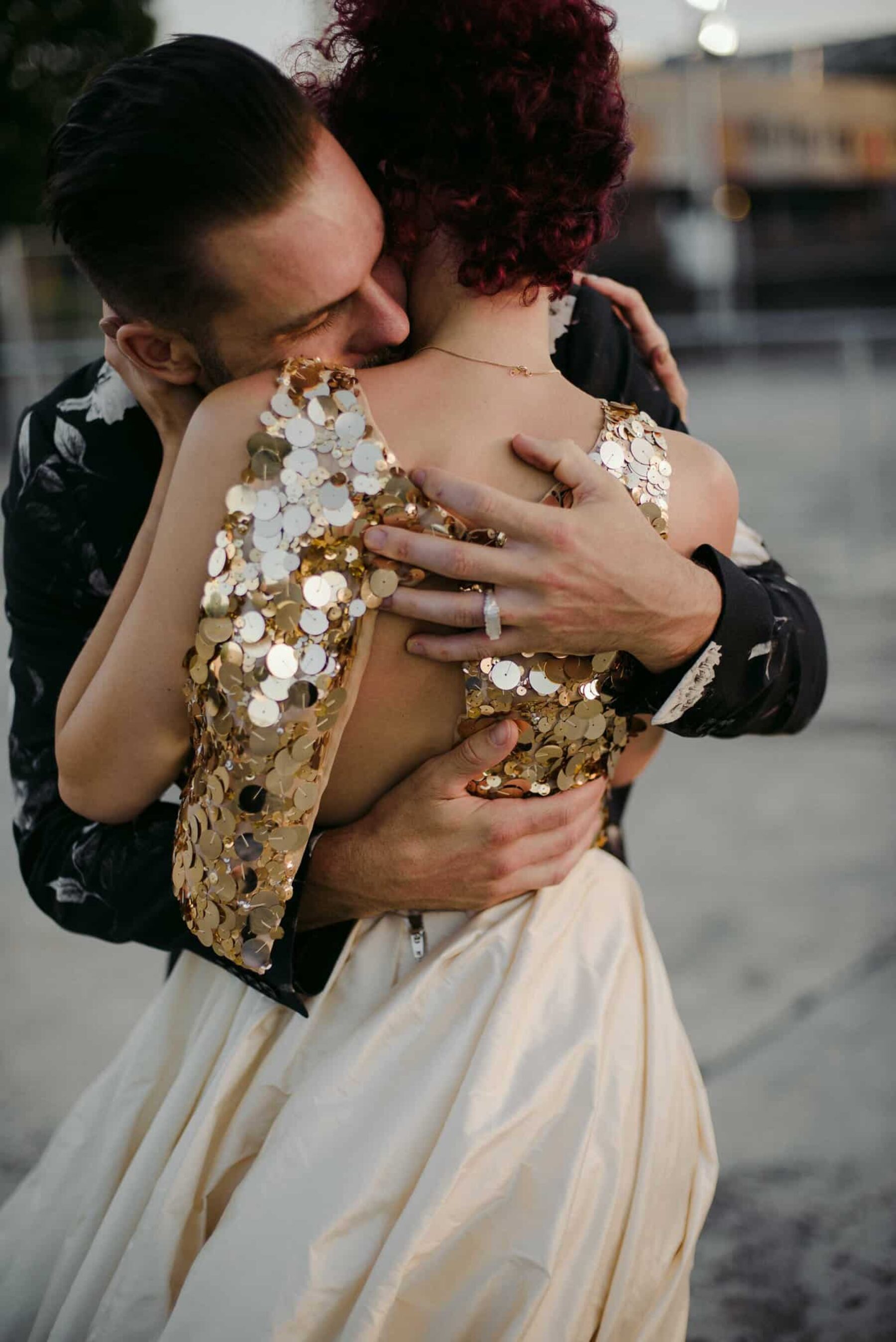 unique bride in gold two-piece wedding dress + groom in floral suit