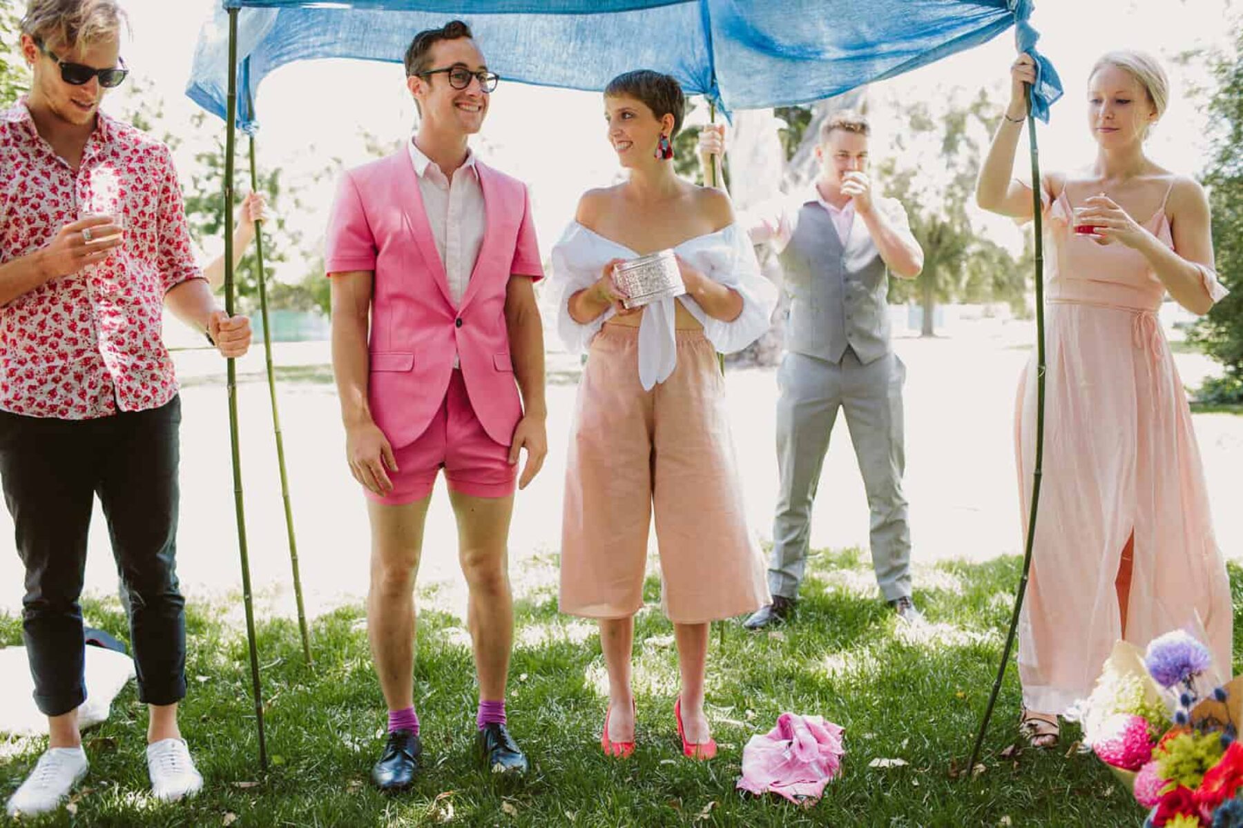 quirky bride and groom in pink