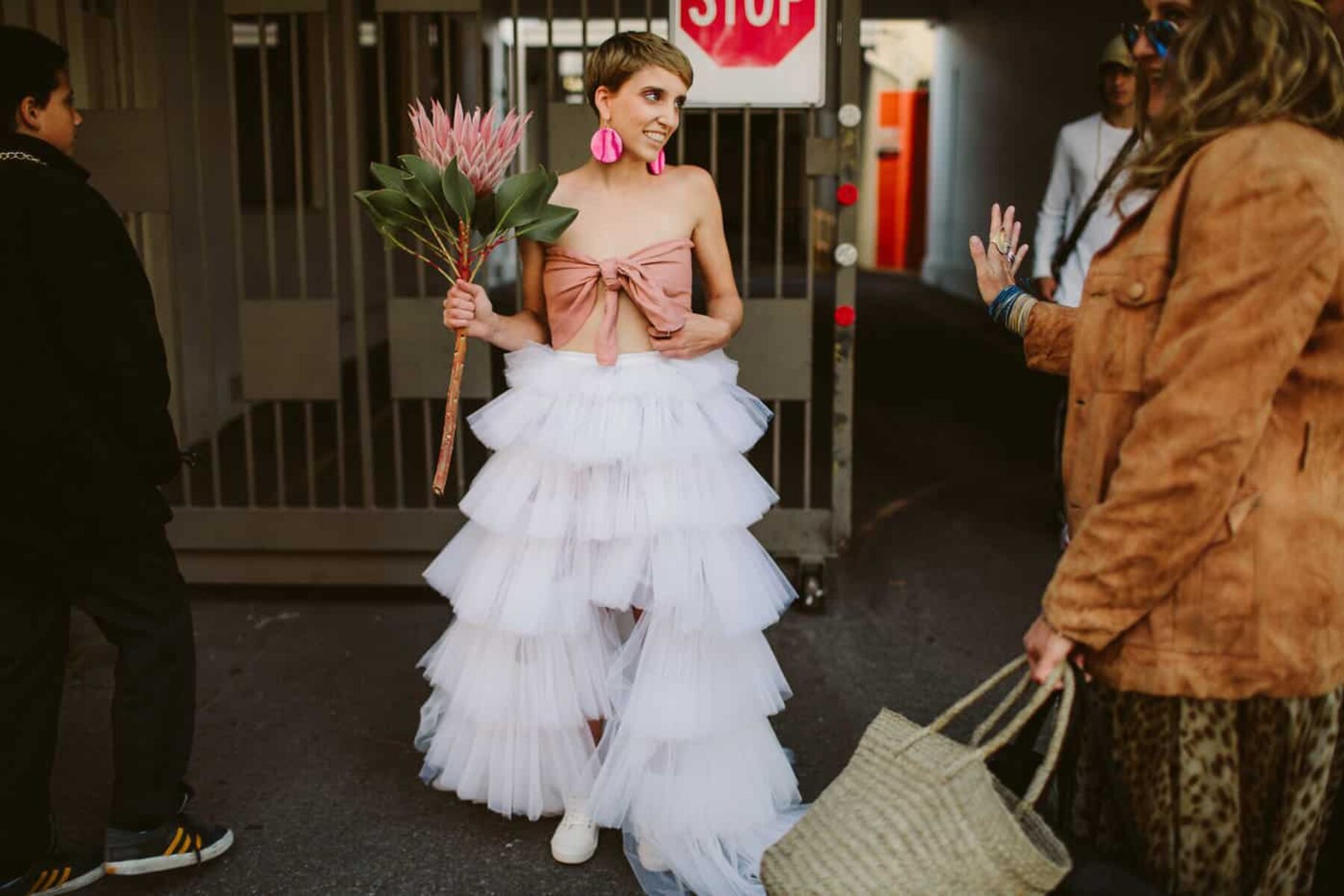 fun, quirky bride in pink bandau and white tulle skirt