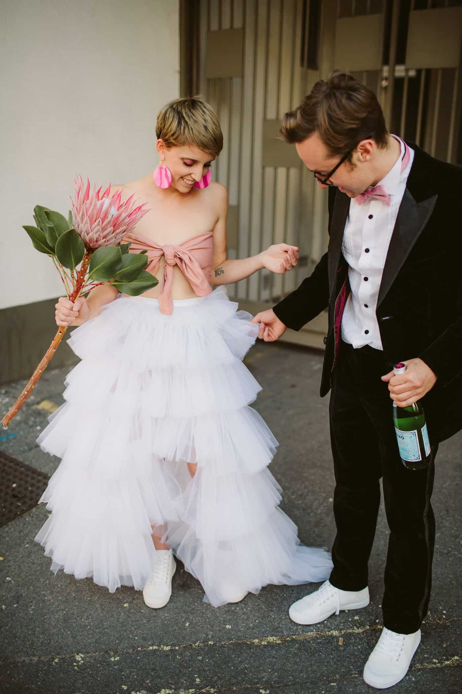 fun, quirky bride in pink bandau and white tulle skirt