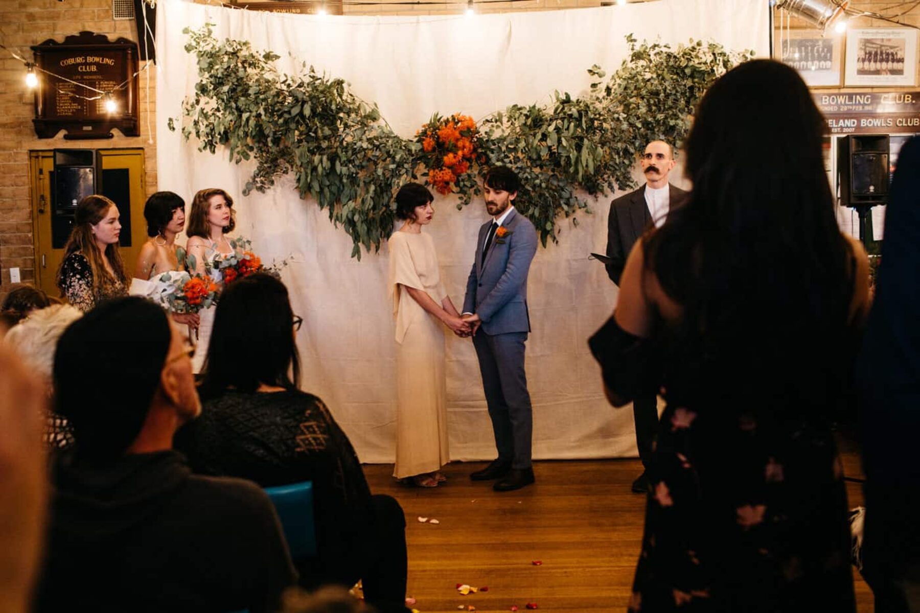 DIY wedding backdrop with native foliage and flowering gum