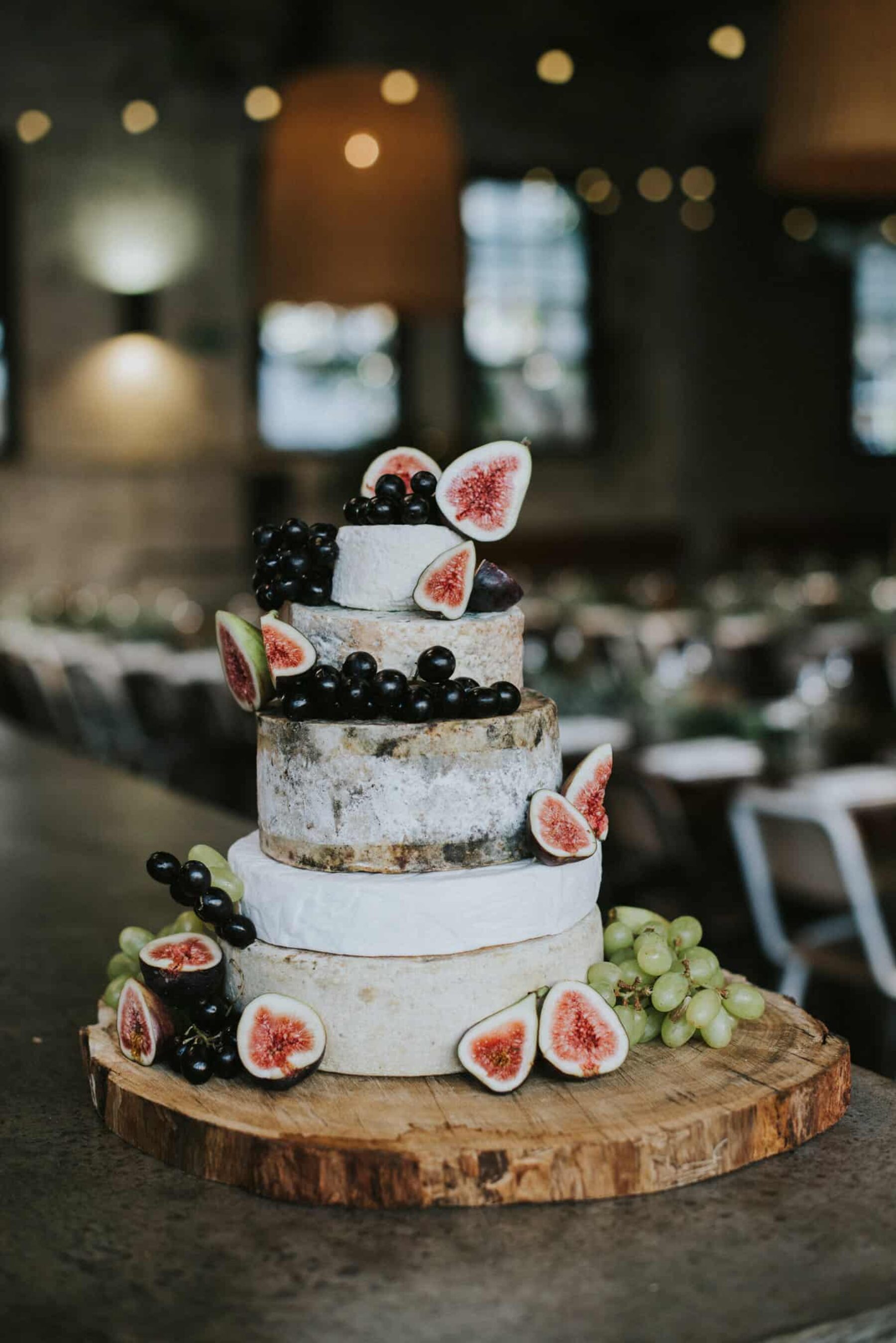 cheese wheel wedding cake with fresh figs