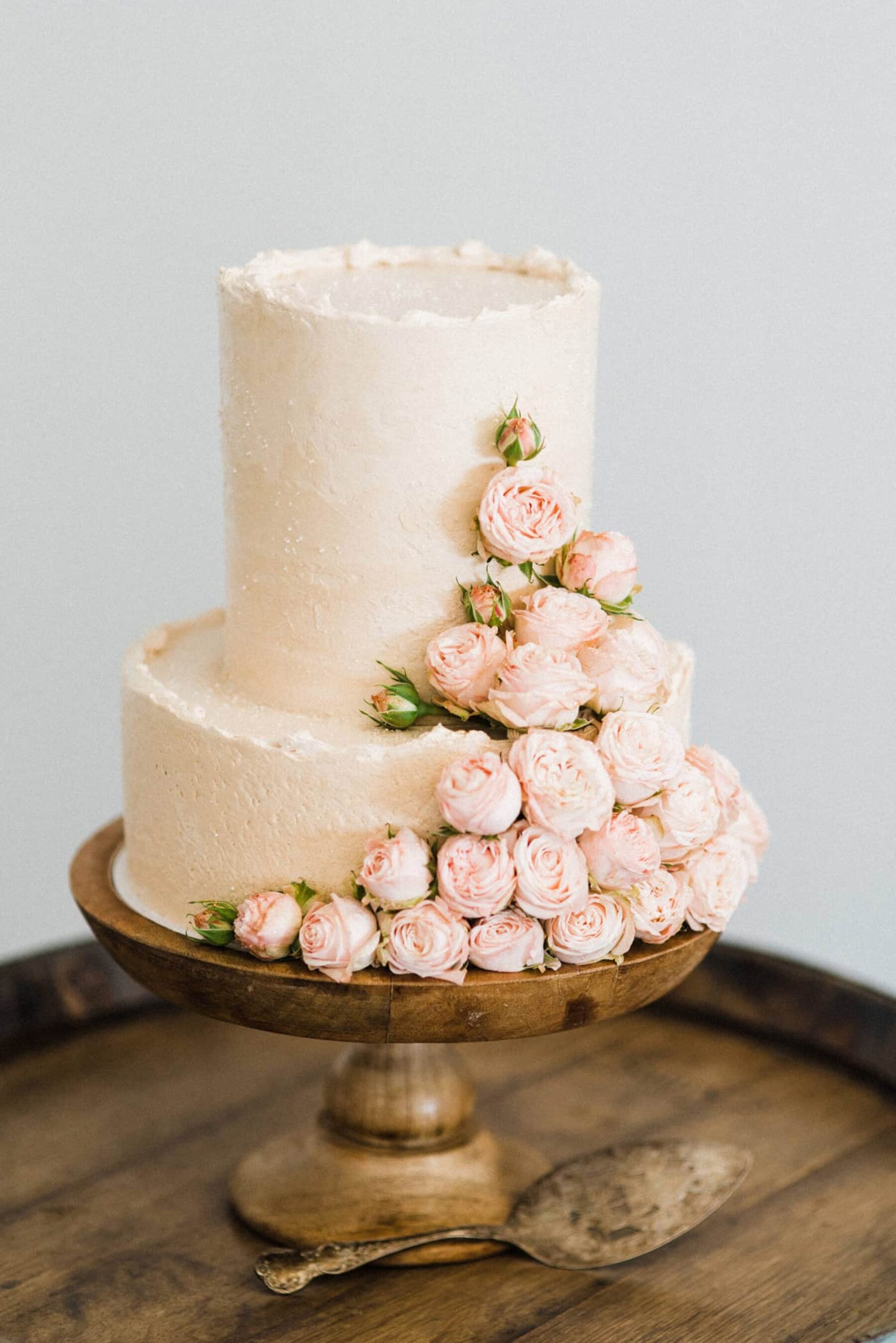 simple blush wedding cake with roses
