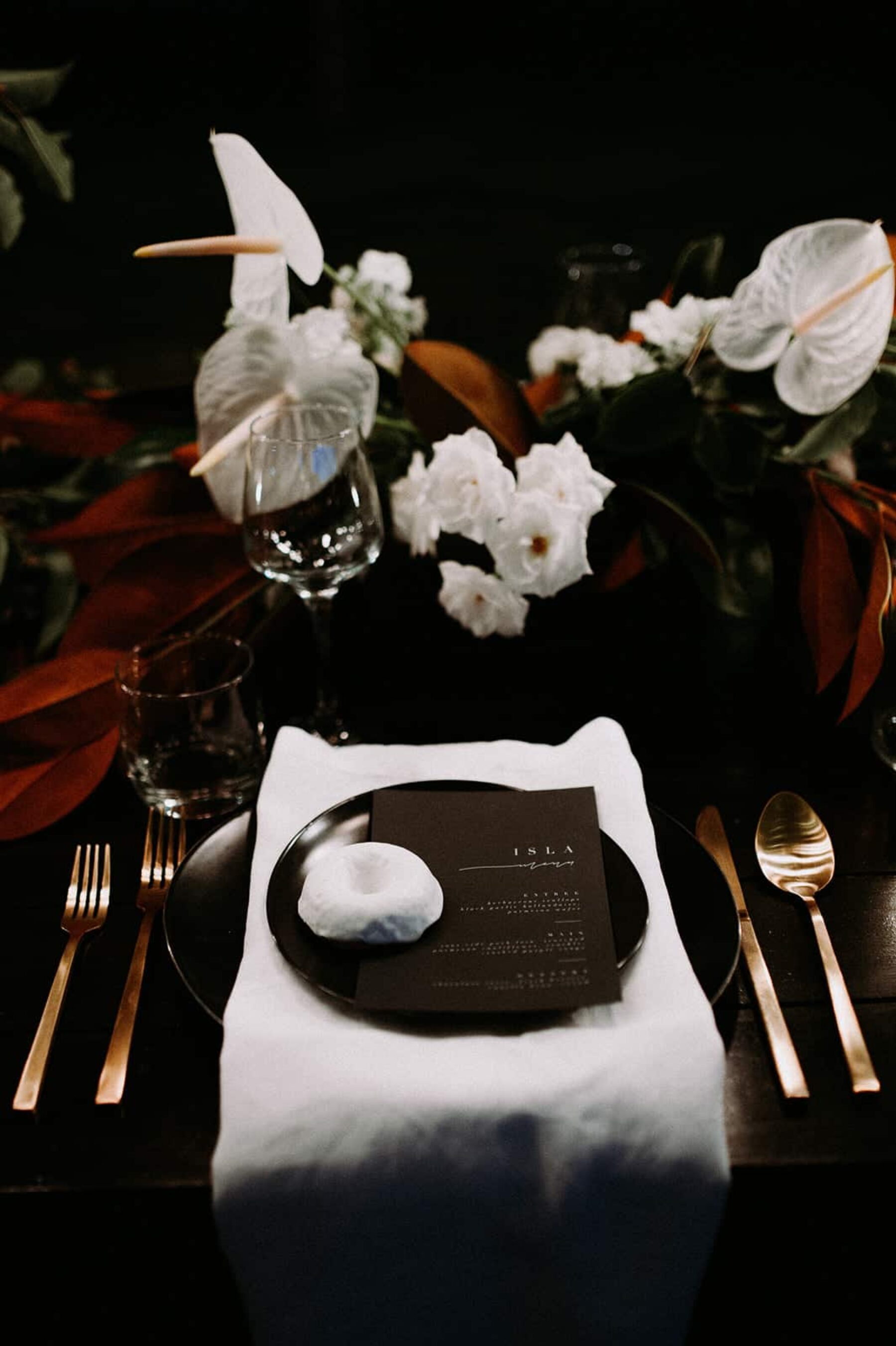 modern tablescape with black crockery and gold cutlery