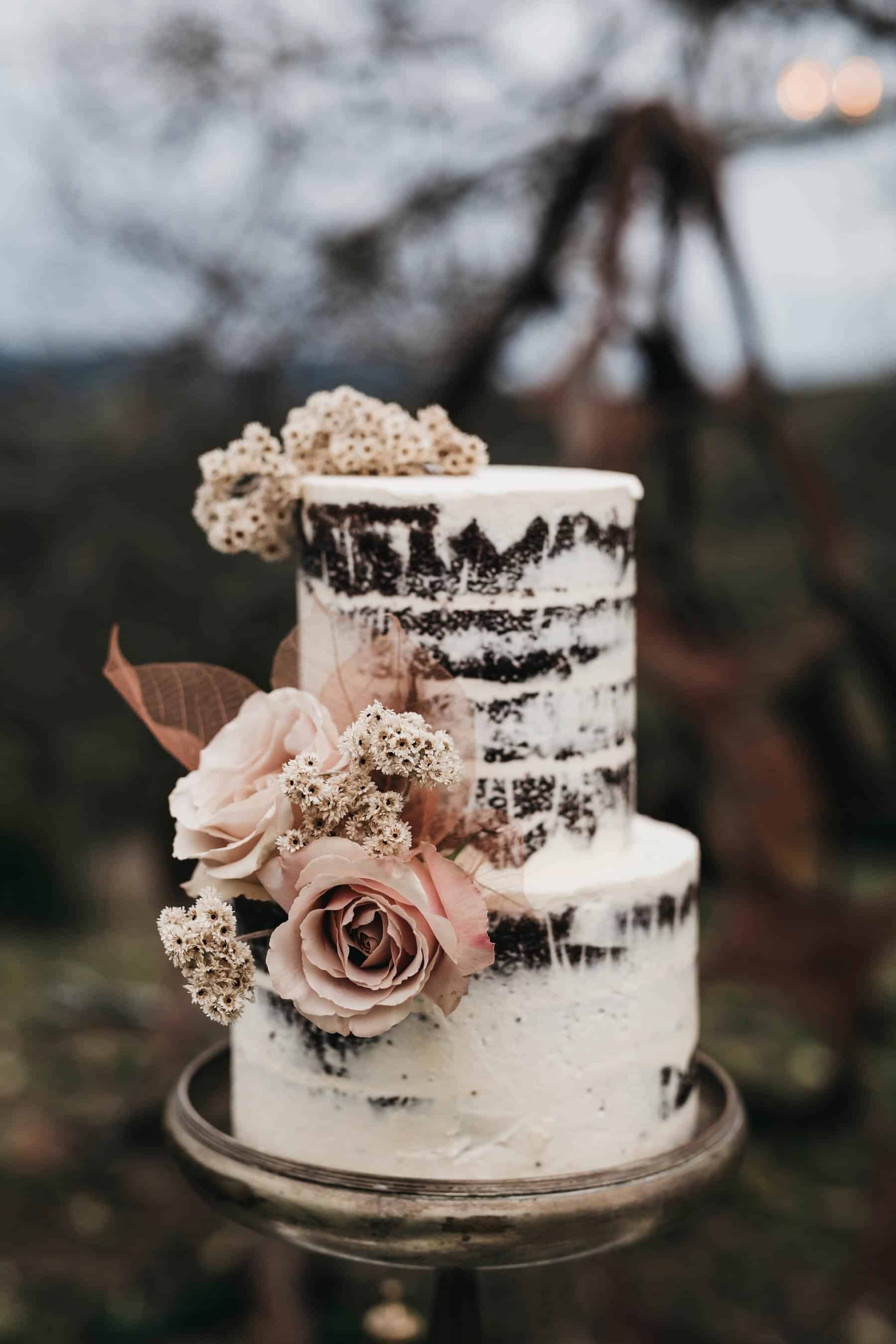 naked wedding cake with blush roses