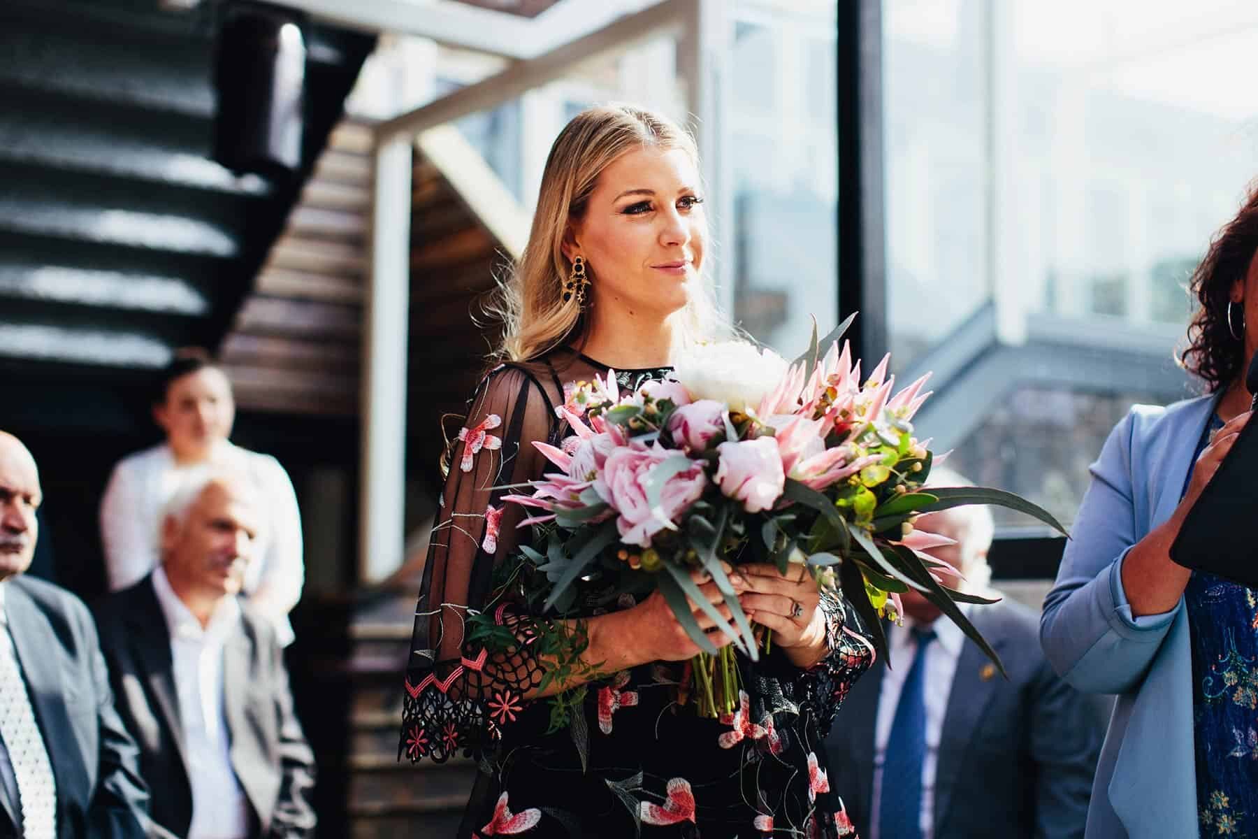 bridesmaid in black floral dress