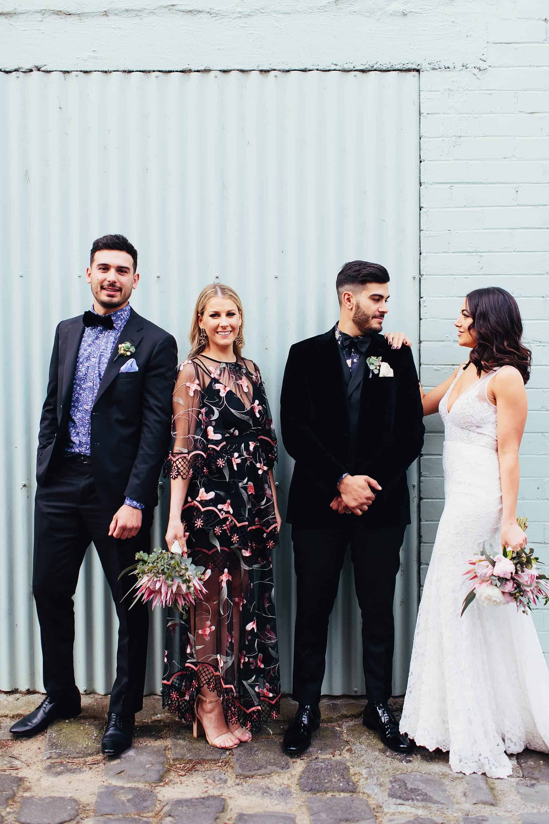 cool bridal party with black floral bridesmaid dress