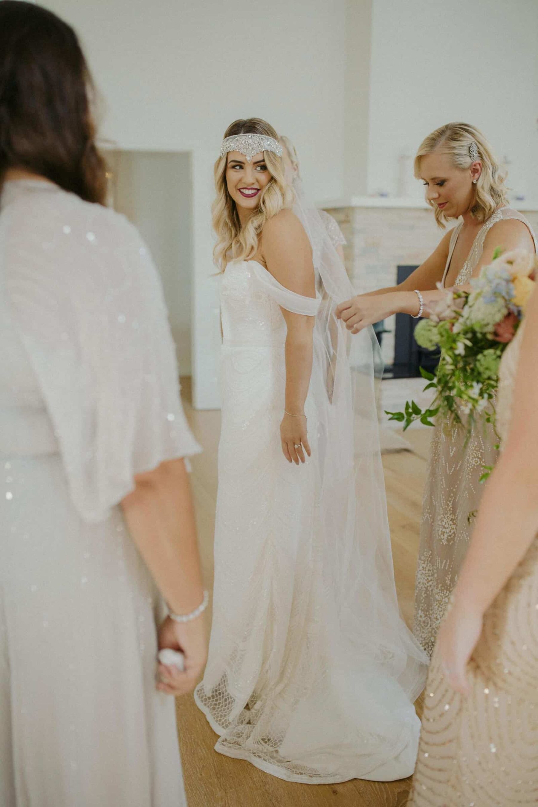 Gatsby inspired bride with off-shoulder wedding dress