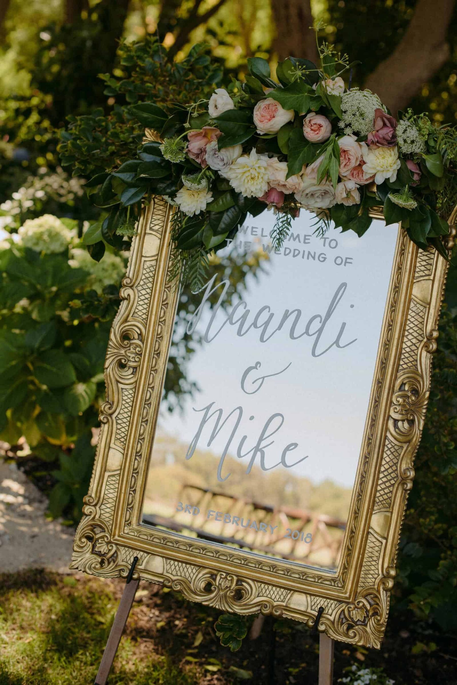 mirror weddding sign with white lettering