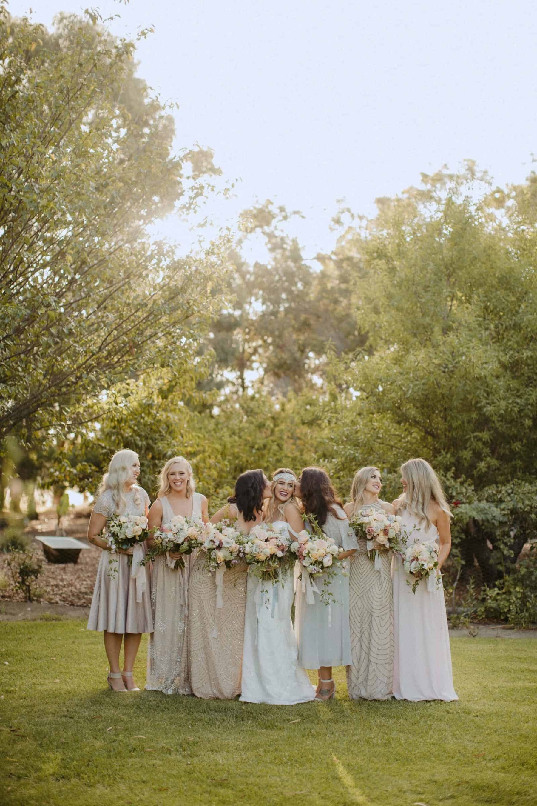 Gatsby inspired bridal party with mismatched neutral bridesmaid dresses