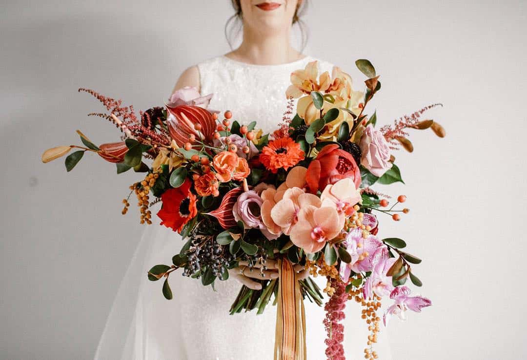 wild, unstructured bridal bouquet with orchids and anthurium