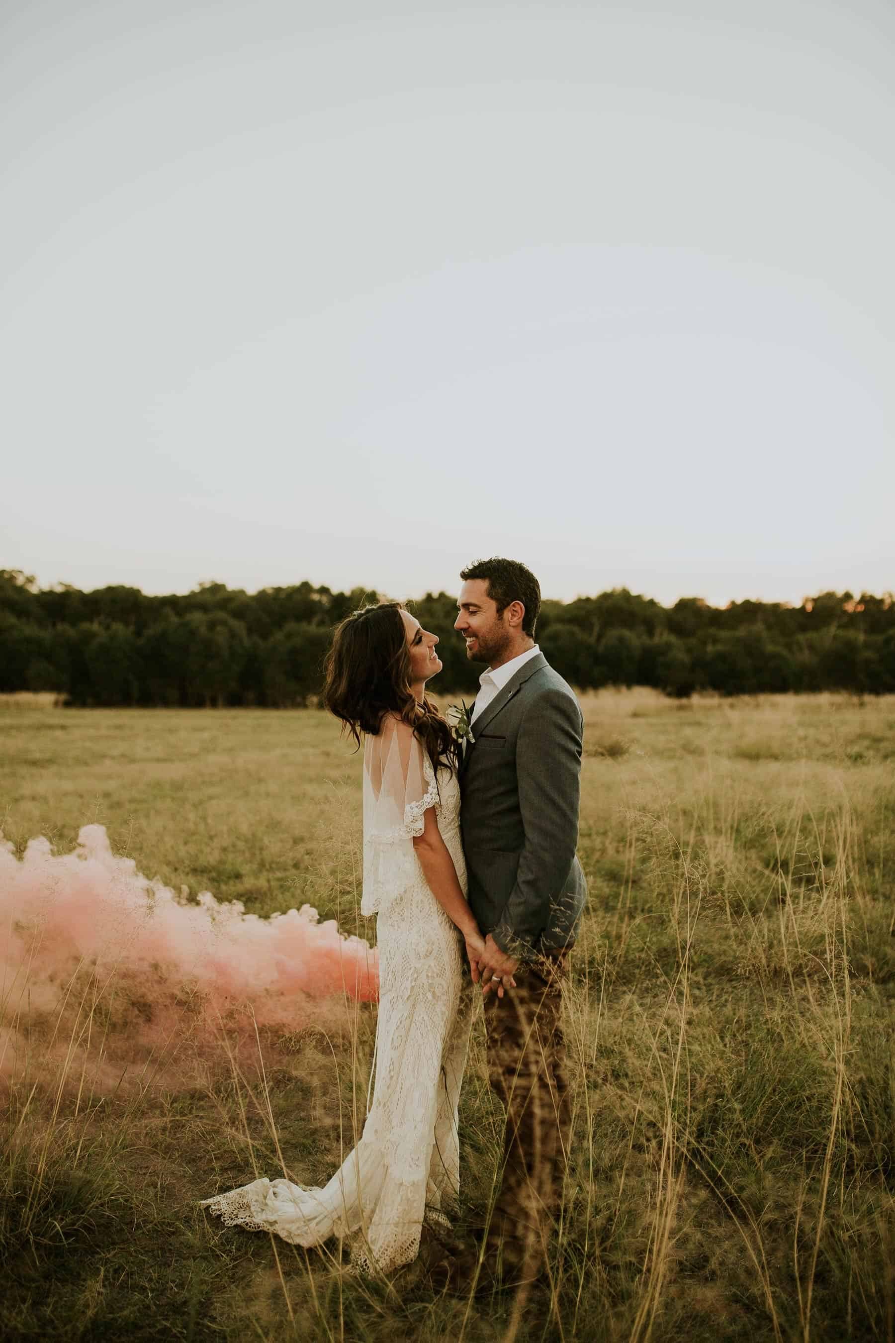 wedding photography with pink smoke bombs