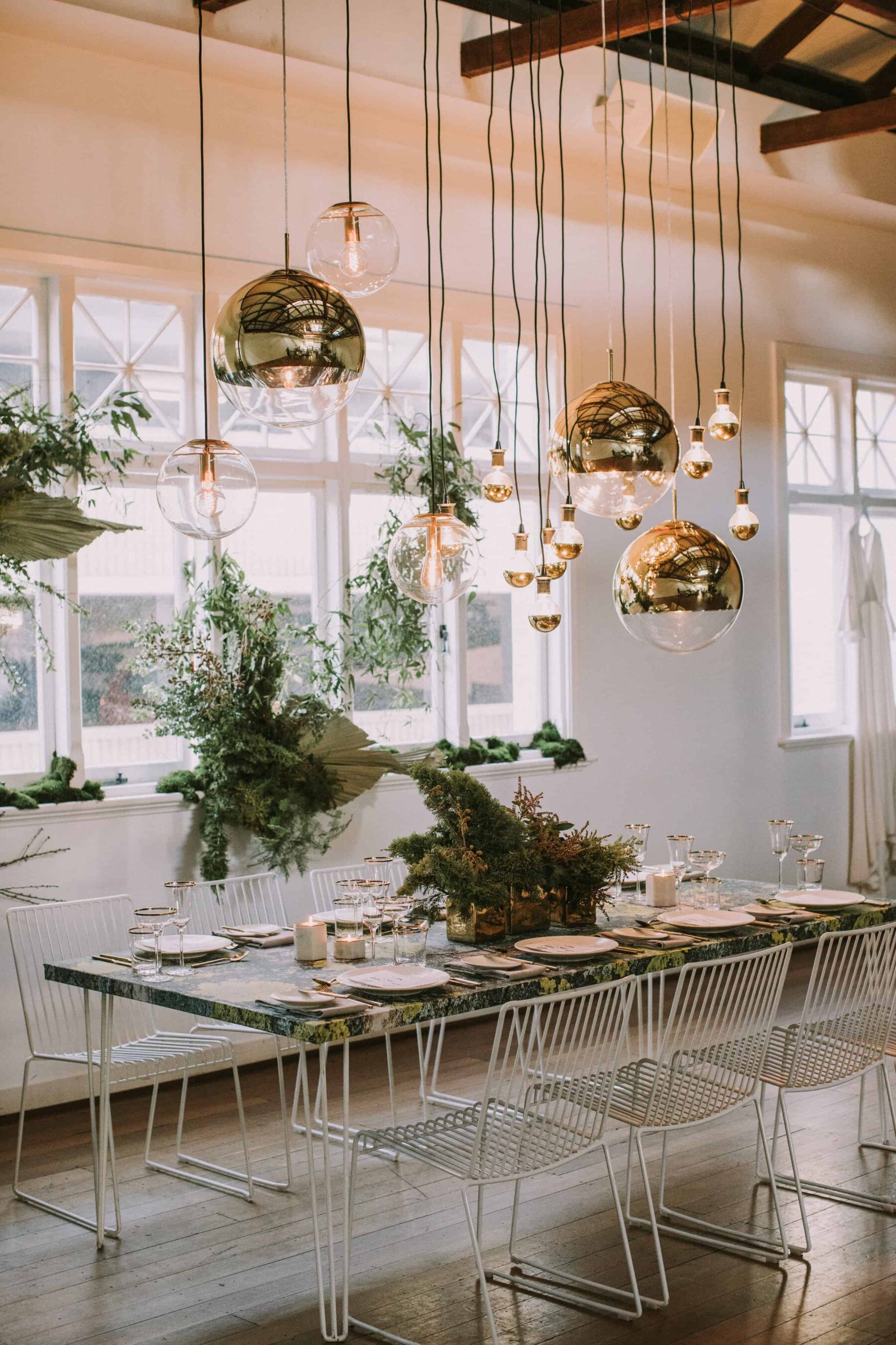 modern tablescape with gold pendant lighting