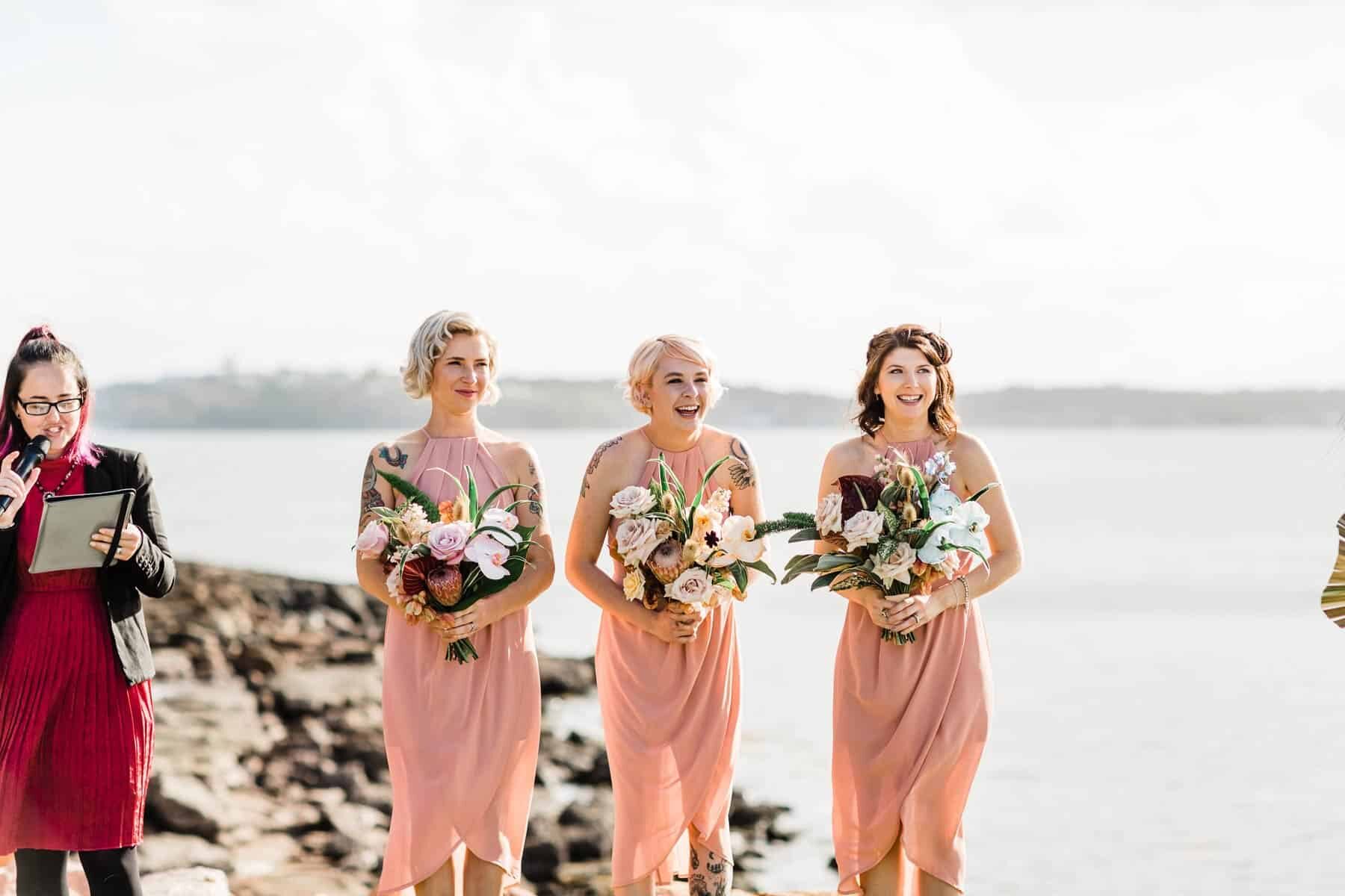 blush bridesmaid dresses with tropical bouquets