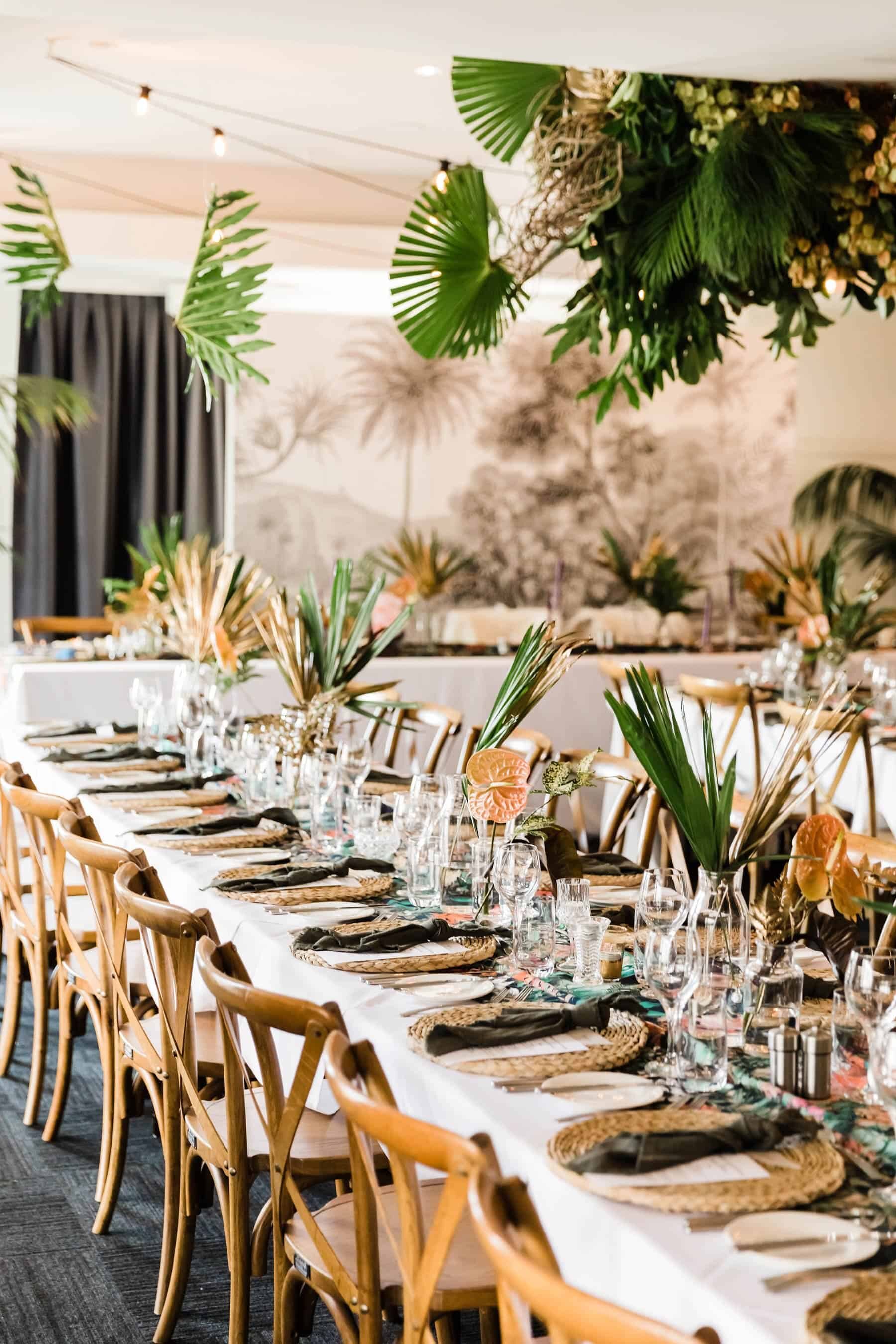 tropical tablescape with hanging greenery