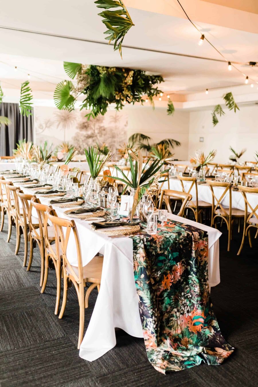 tropical tablescape with hanging greenery