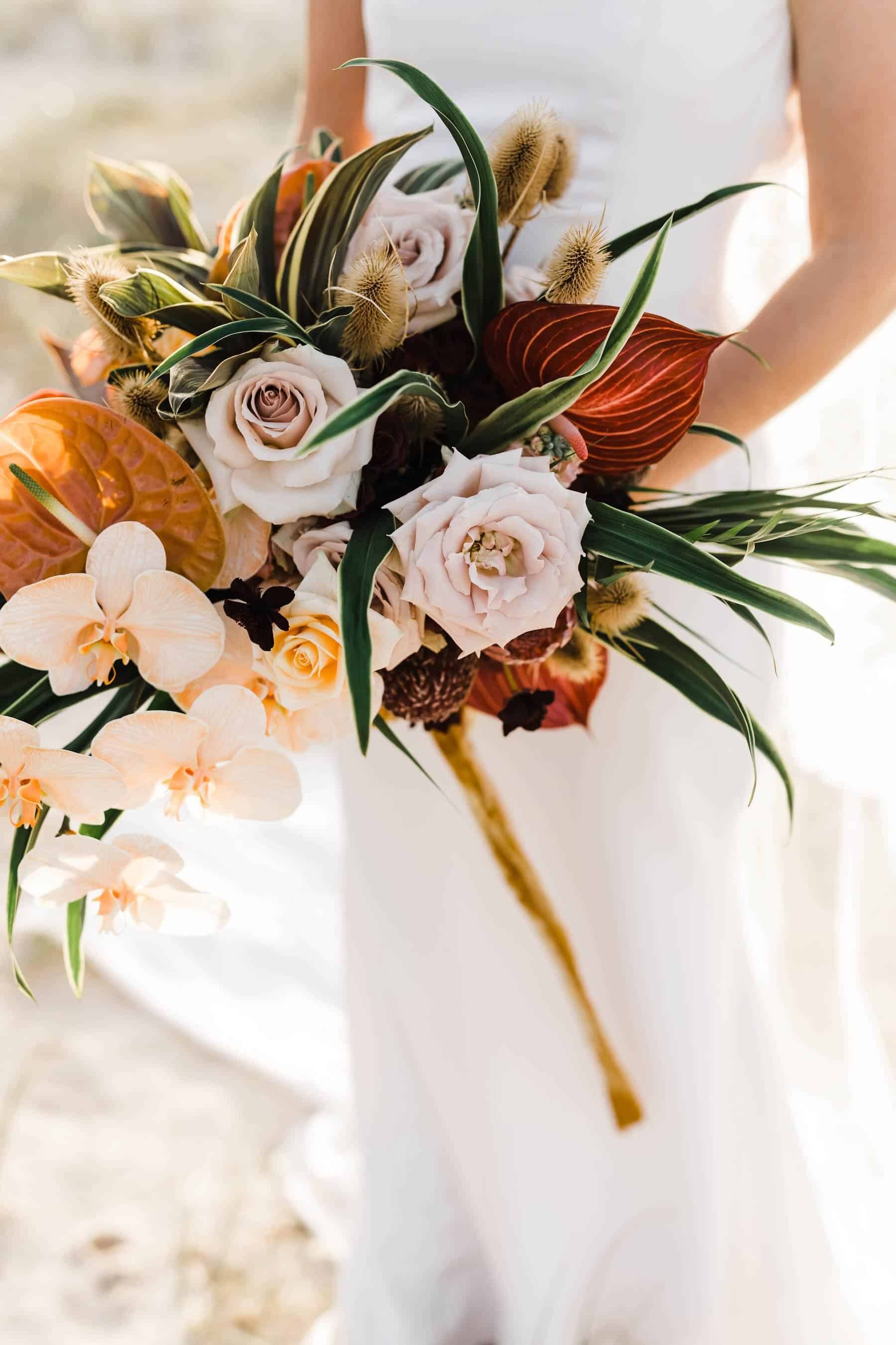 tropical bridal bouquet with blush orchids
