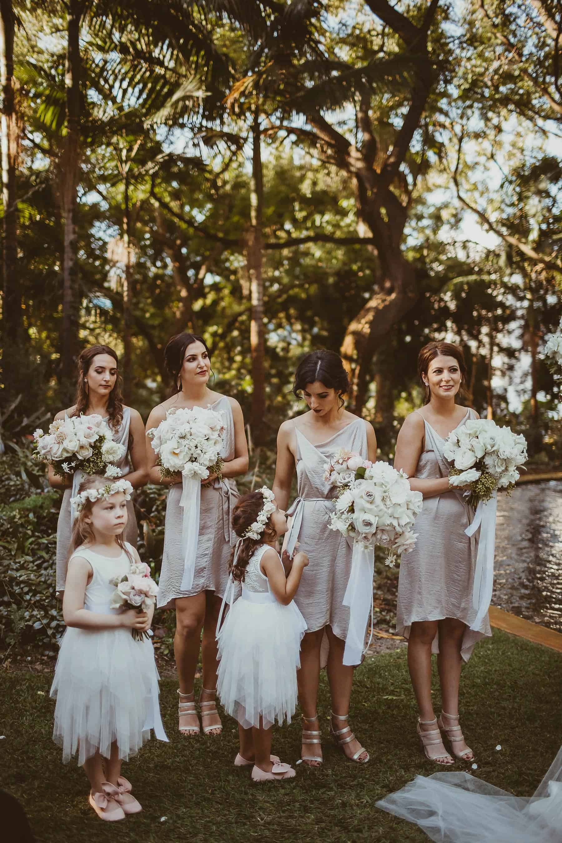 flower girls and bridesmaids in nude blush dresses