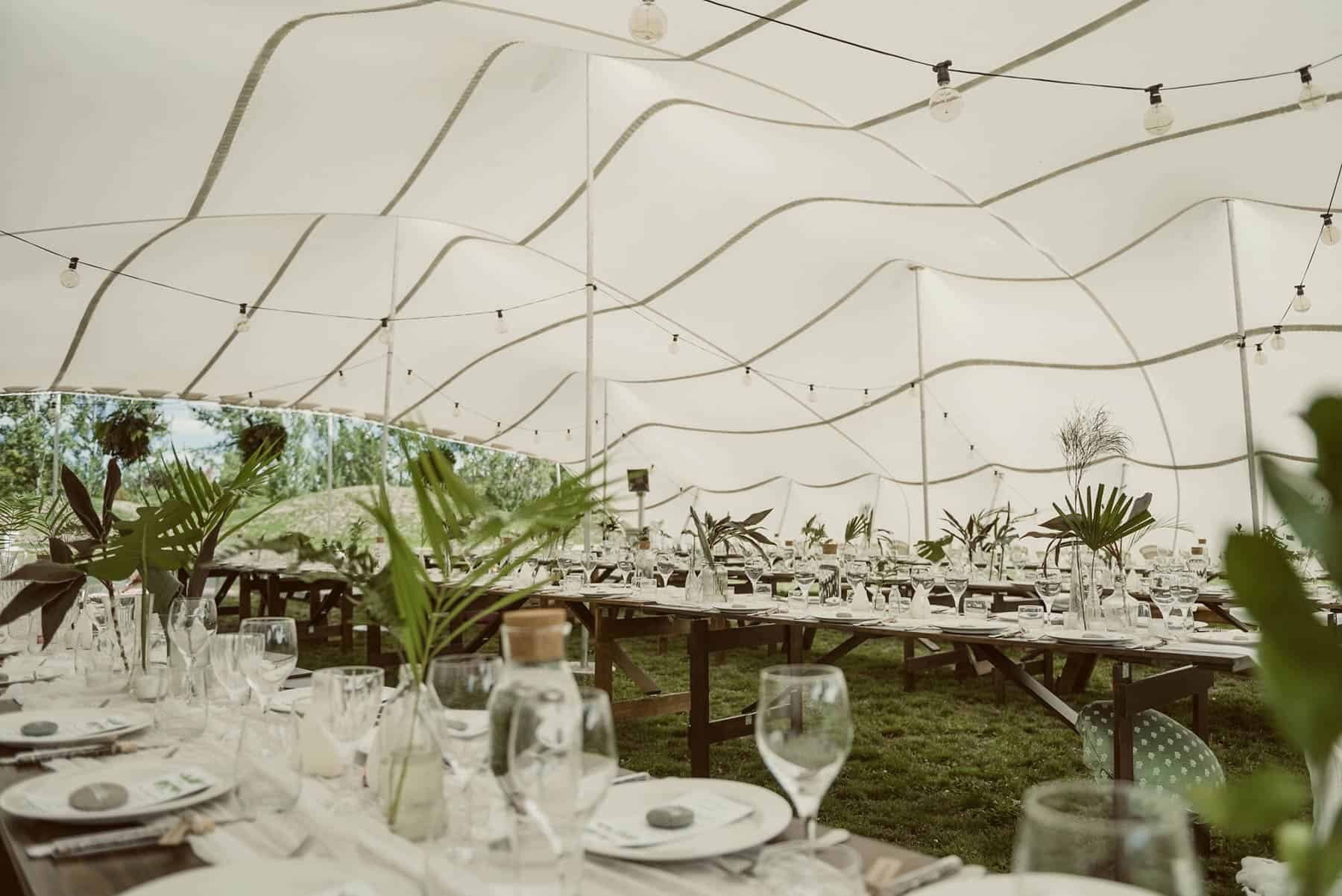 modern marquee wedding with loads of greenery