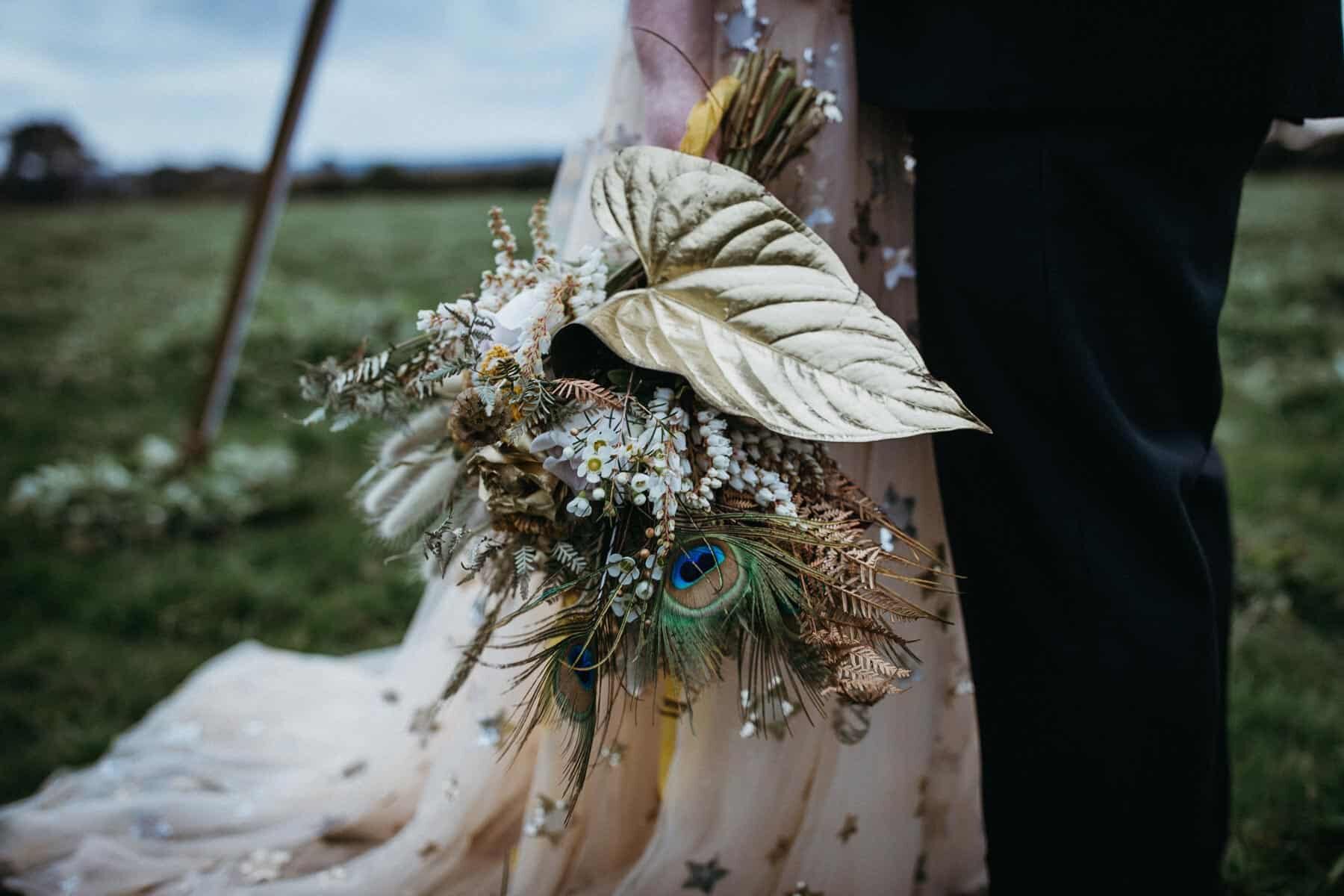 preserved native bouquet with feathers and gold painted leaf