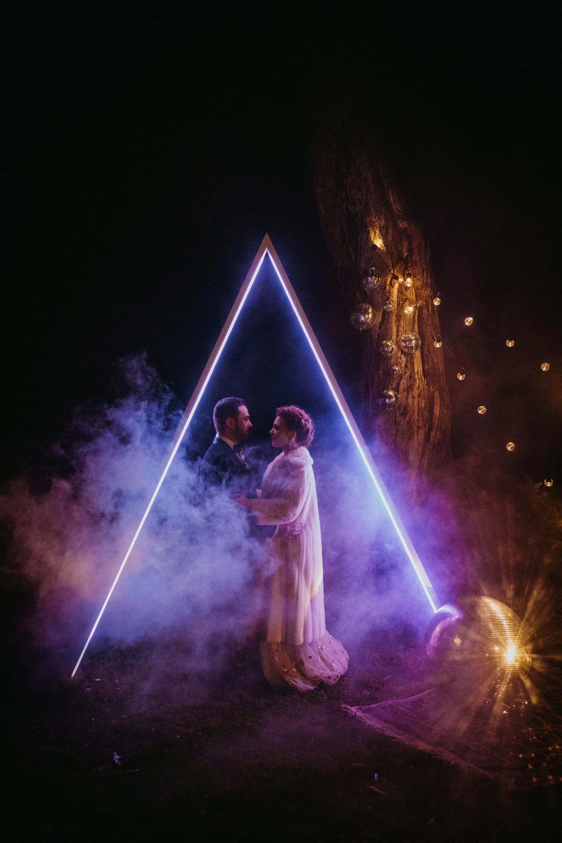 geometric LED illuminated triangle wedding arbours